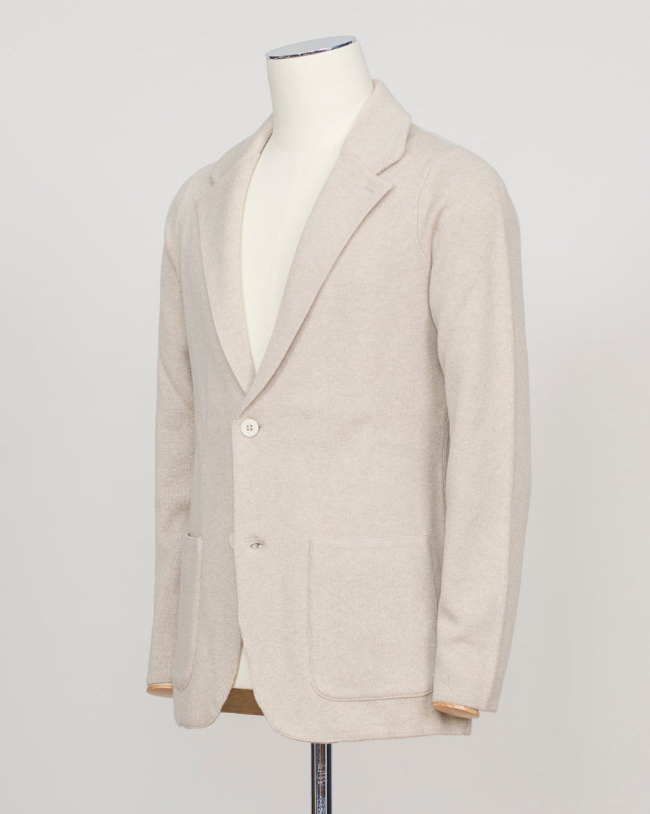 A relaxed knitted blazer in natural tone—effortless layering for your everyday wardrobe. The soft construction works equally well over a crisp shirt or casual tee, making it your go-to piece for transitional dressing. FLY3 Knitted Blazer / Natural