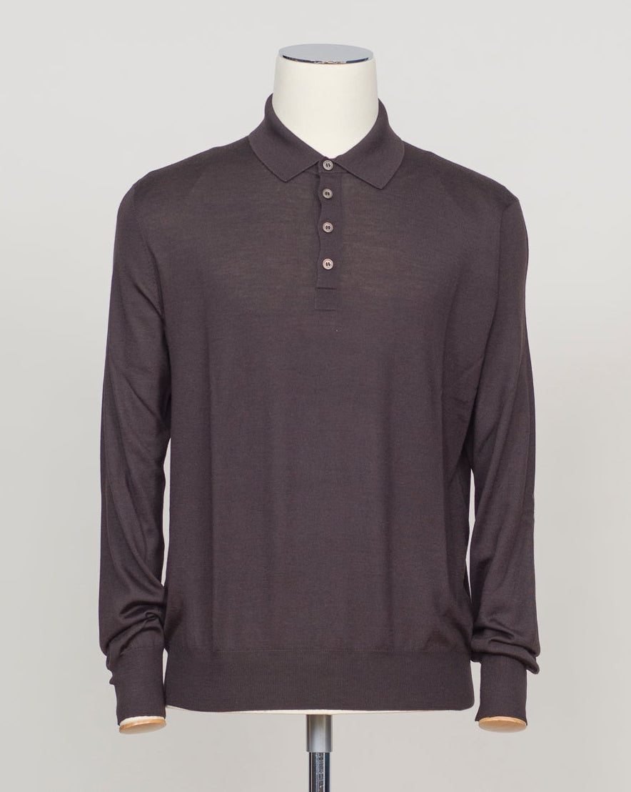 A refined three-ply knit polo crafted from a luxurious blend of merino wool, cashmere, and silk. The dark brown tone offers versatility across seasons, while the natural fiber composition ensures breathability and a subtle sheen. Designed for the discerning wearer who values both comfort and understated elegance. Gran Sasso Wool Cashmere & Silk Polo / Dark Brown