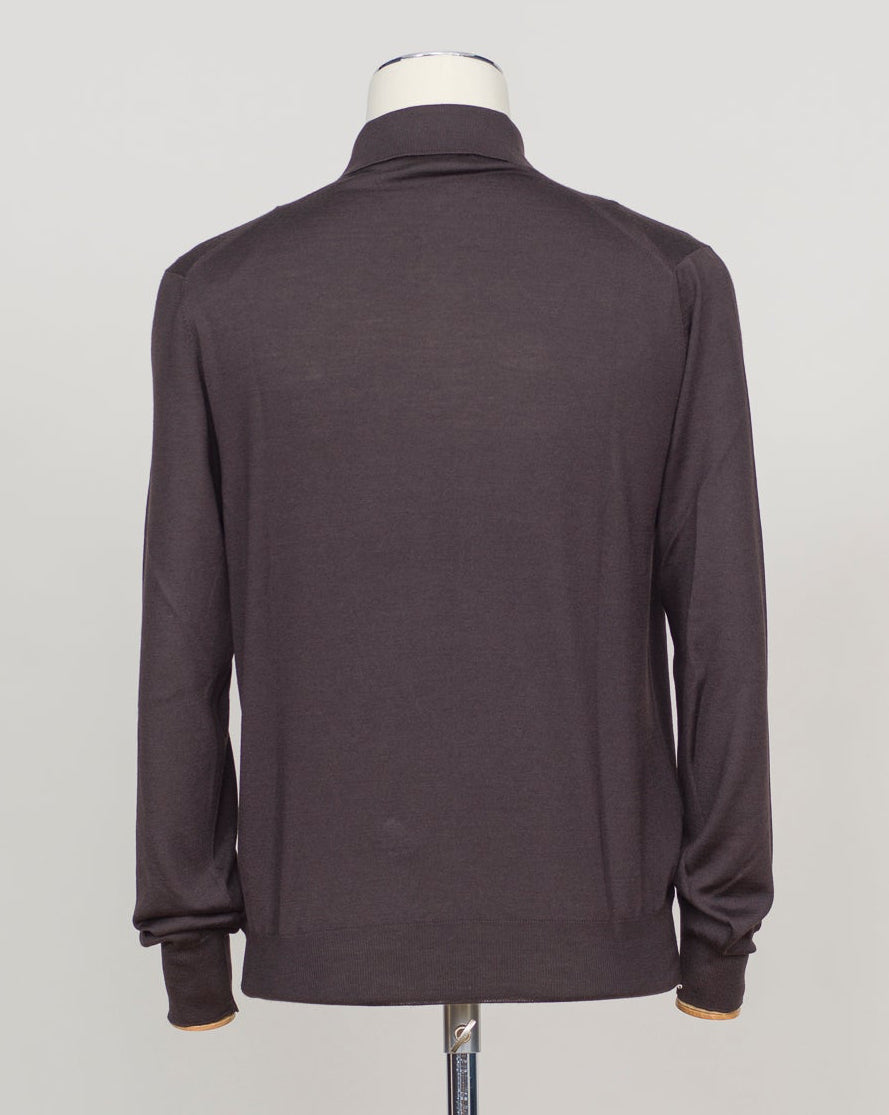 A refined three-ply knit polo crafted from a luxurious blend of merino wool, cashmere, and silk. The dark brown tone offers versatility across seasons, while the natural fiber composition ensures breathability and a subtle sheen. Designed for the discerning wearer who values both comfort and understated elegance. Gran Sasso Wool Cashmere & Silk Polo / Dark Brown