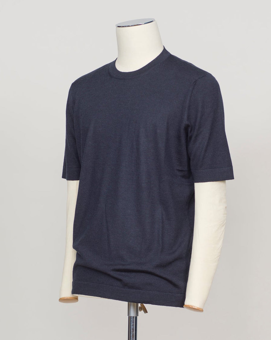 Luxurious blend of wool, cashmere, and silk in a refined navy knit. Gran Sasso's signature lightweight construction offers effortless elegance and breathable comfort. Perfect layered or worn solo for understated sophistication. Gran Sasso Wool Cashmere & Silk T-Shirt / Navy
