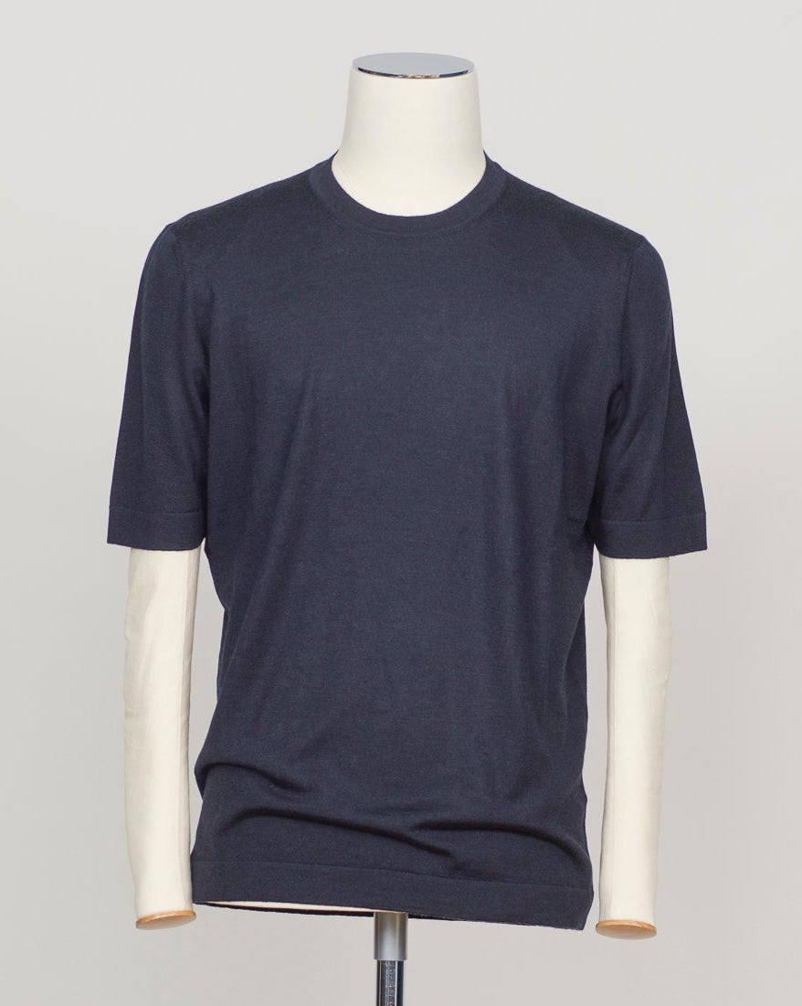 Luxurious blend of wool, cashmere, and silk in a refined navy knit. Gran Sasso's signature lightweight construction offers effortless elegance and breathable comfort. Perfect layered or worn solo for understated sophistication. Gran Sasso Wool Cashmere & Silk T-Shirt / Navy