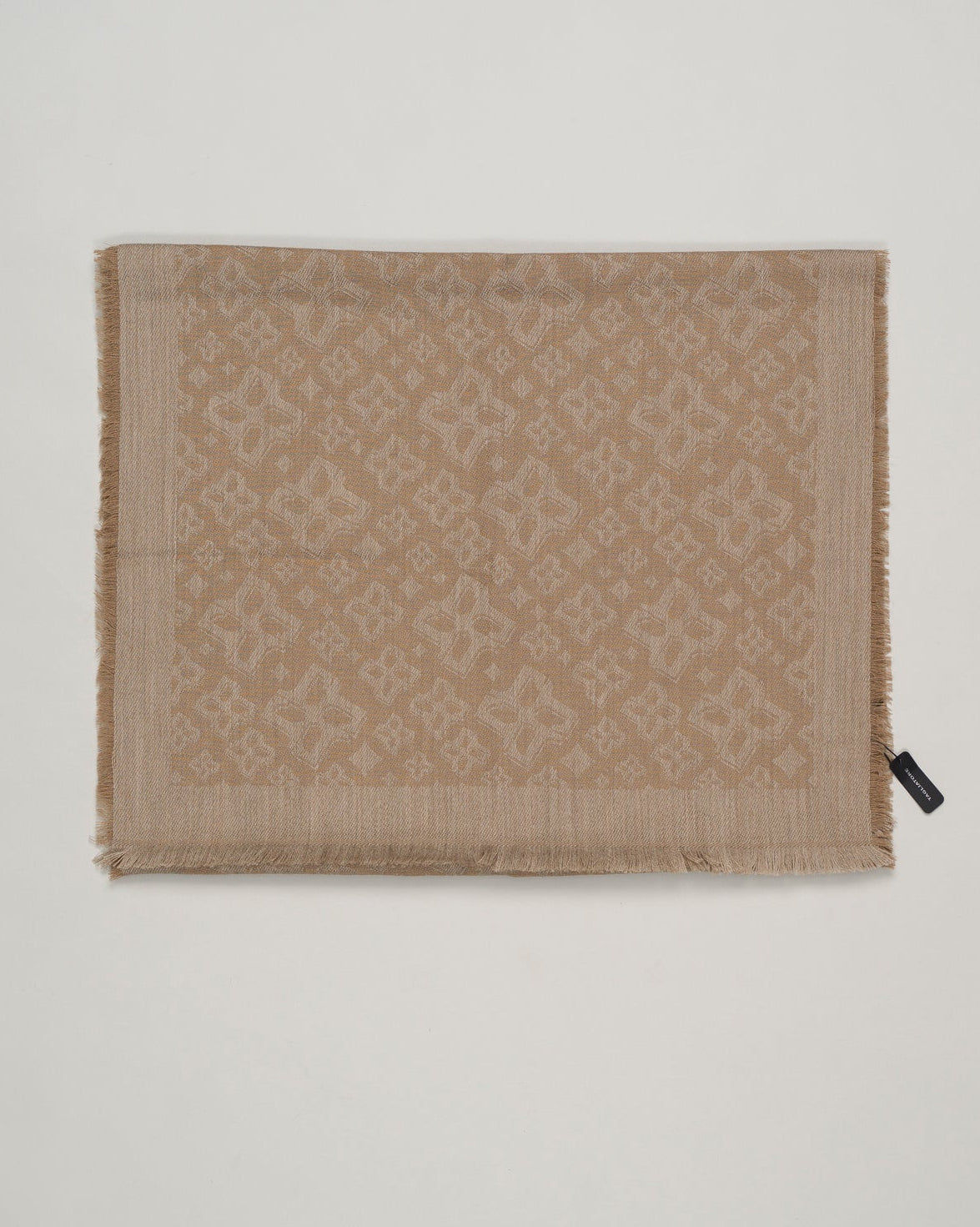 Tagliatore scarf with tone-on-tone jacquard logo. Material is 100% wool, which ensures practicality and functionality in the same package. Tagliatore Wool Scarf / Taupe