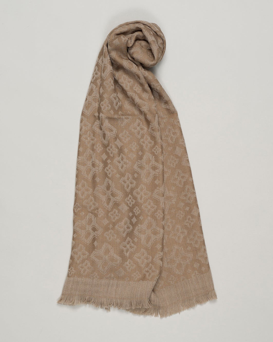 Tagliatore scarf with tone-on-tone jacquard logo. Material is 100% wool, which ensures practicality and functionality in the same package. Tagliatore Wool Scarf / Taupe