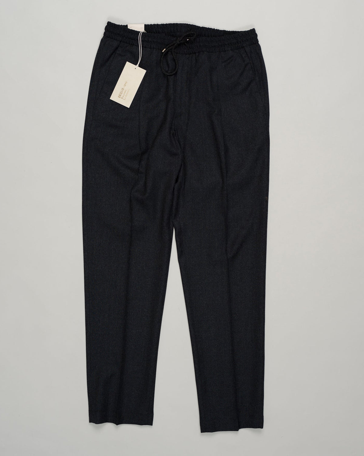 Italian tailoring meets everyday ease. These Briglia drawstring flannels in navy offer a relaxed fit with refined detailing. Soft flannel construction with an adjustable waist ensures comfort without compromise. Briglia Drawstring Flannel Trousers / Navy