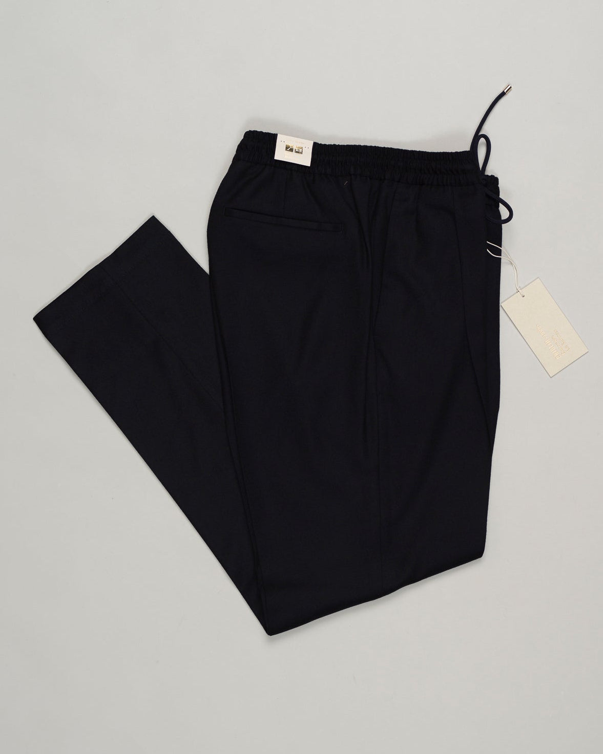 Italian tailoring meets everyday ease. These Briglia drawstring flannels in navy offer a relaxed fit with refined detailing. Soft flannel construction with an adjustable waist ensures comfort without compromise. Briglia Drawstring Flannel Trousers / Navy