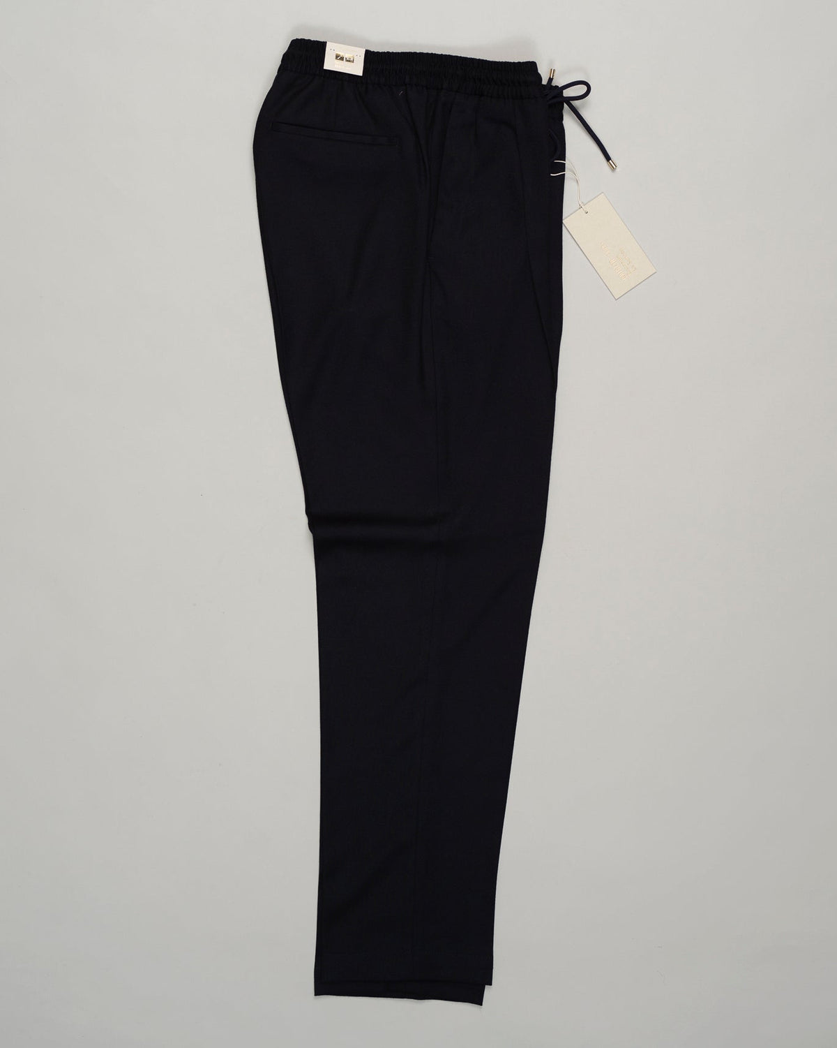 Italian tailoring meets everyday ease. These Briglia drawstring flannels in navy offer a relaxed fit with refined detailing. Soft flannel construction with an adjustable waist ensures comfort without compromise. Briglia Drawstring Flannel Trousers / Navy