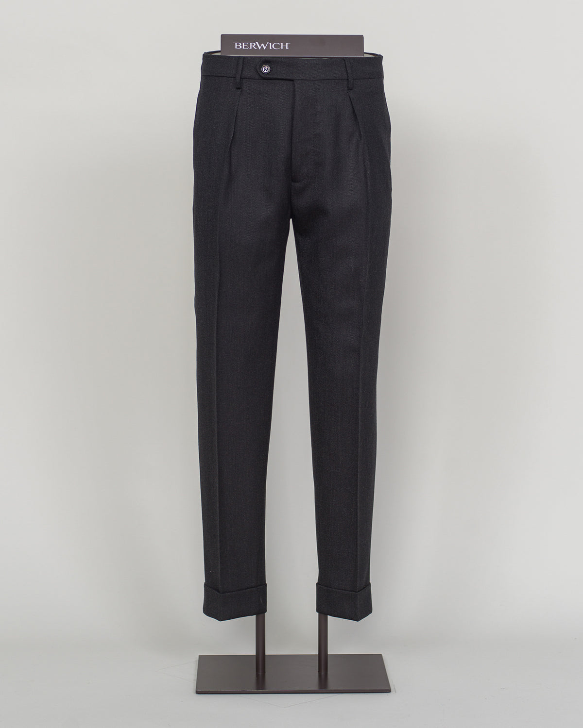 Berwich's Chiaia represents timeless tailoring craftsmanship. These wool covert trousers are cut from premium wool in classic black, designed for refined simplicity and enduring wear. The structured fabric offers subtle texture while maintaining elegance across seasons. A sophisticated foundation for curated wardrobes and versatile pairing with blazers, knitwear, and formal wear.