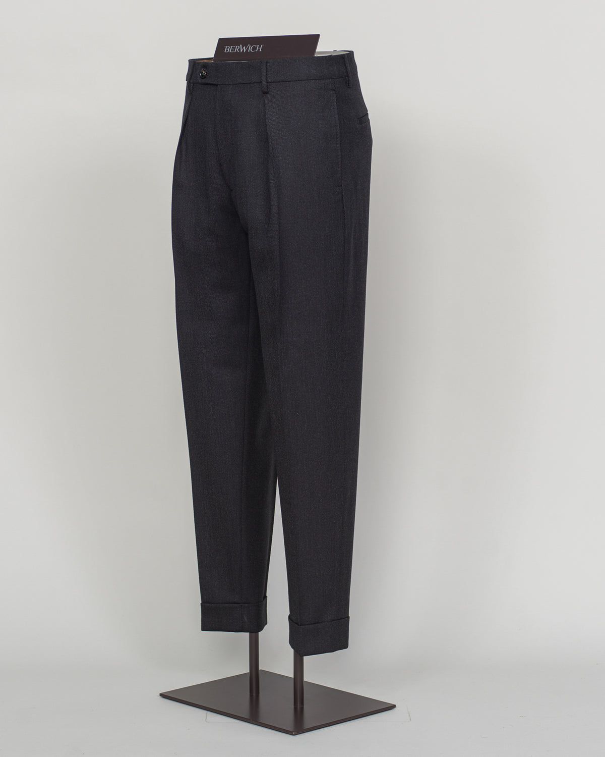 Berwich's Chiaia represents timeless tailoring craftsmanship. These wool covert trousers are cut from premium wool in classic black, designed for refined simplicity and enduring wear. The structured fabric offers subtle texture while maintaining elegance across seasons. A sophisticated foundation for curated wardrobes and versatile pairing with blazers, knitwear, and formal wear.
