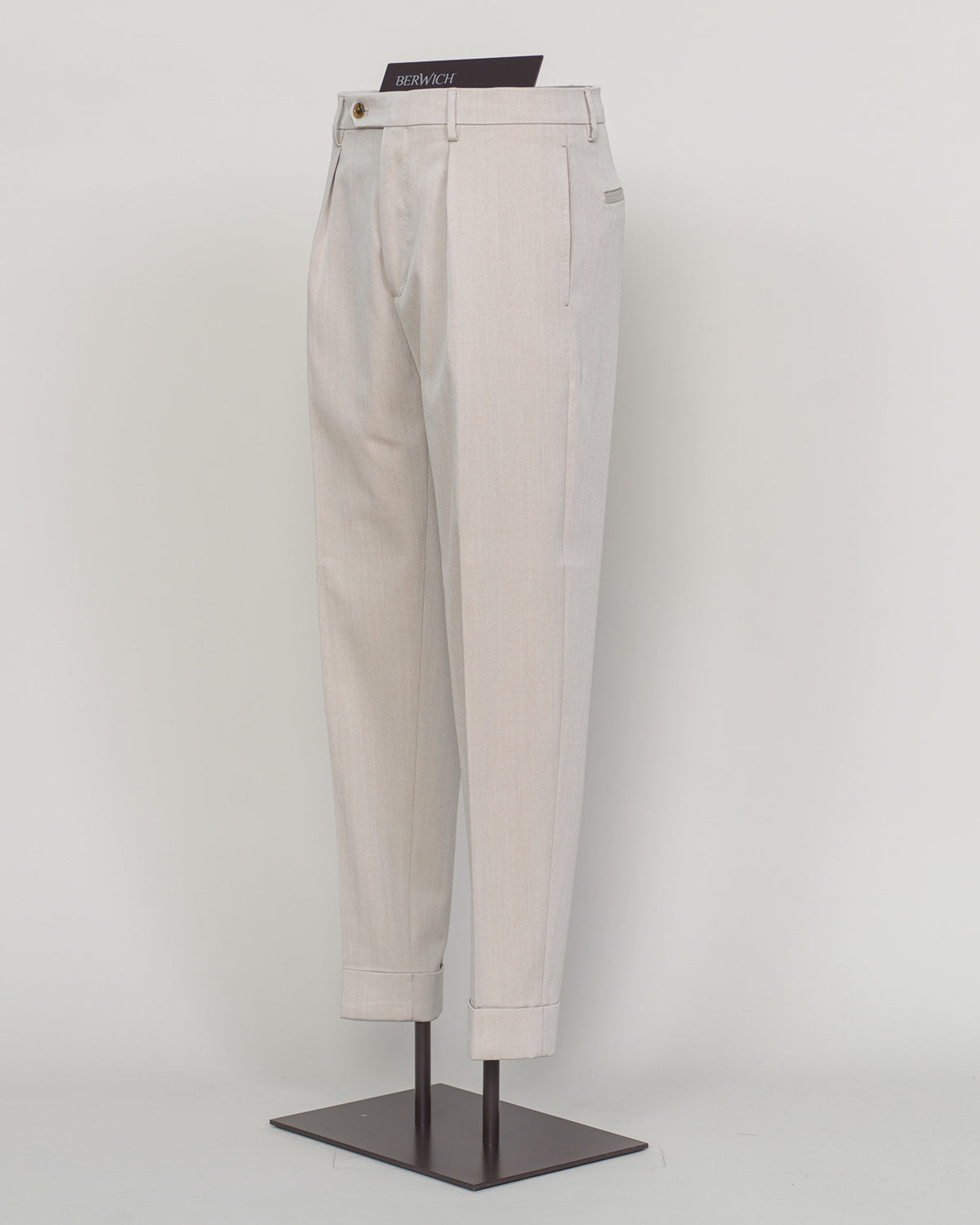 Crafted from a refined blend of wool and cotton, these Berwich trousers exemplify Italian tailoring at its finest. The long-staple gabardine weave delivers a subtle lustre and exceptional drape, while the balanced fibre composition ensures breathability and durability across seasons.
The versatile chalk tone pairs seamlessly with sport coats, knitwear, and tailored jackets. Clean lines and a measured cut reflect contemporary menswear proportions without compromise on classic elegance.
A foundation piece f