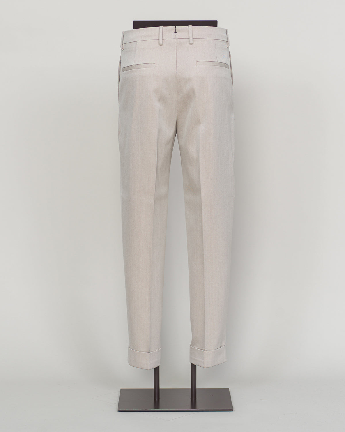 Crafted from a refined blend of wool and cotton, these Berwich trousers exemplify Italian tailoring at its finest. The long-staple gabardine weave delivers a subtle lustre and exceptional drape, while the balanced fibre composition ensures breathability and durability across seasons.
The versatile chalk tone pairs seamlessly with sport coats, knitwear, and tailored jackets. Clean lines and a measured cut reflect contemporary menswear proportions without compromise on classic elegance.
A foundation piece f