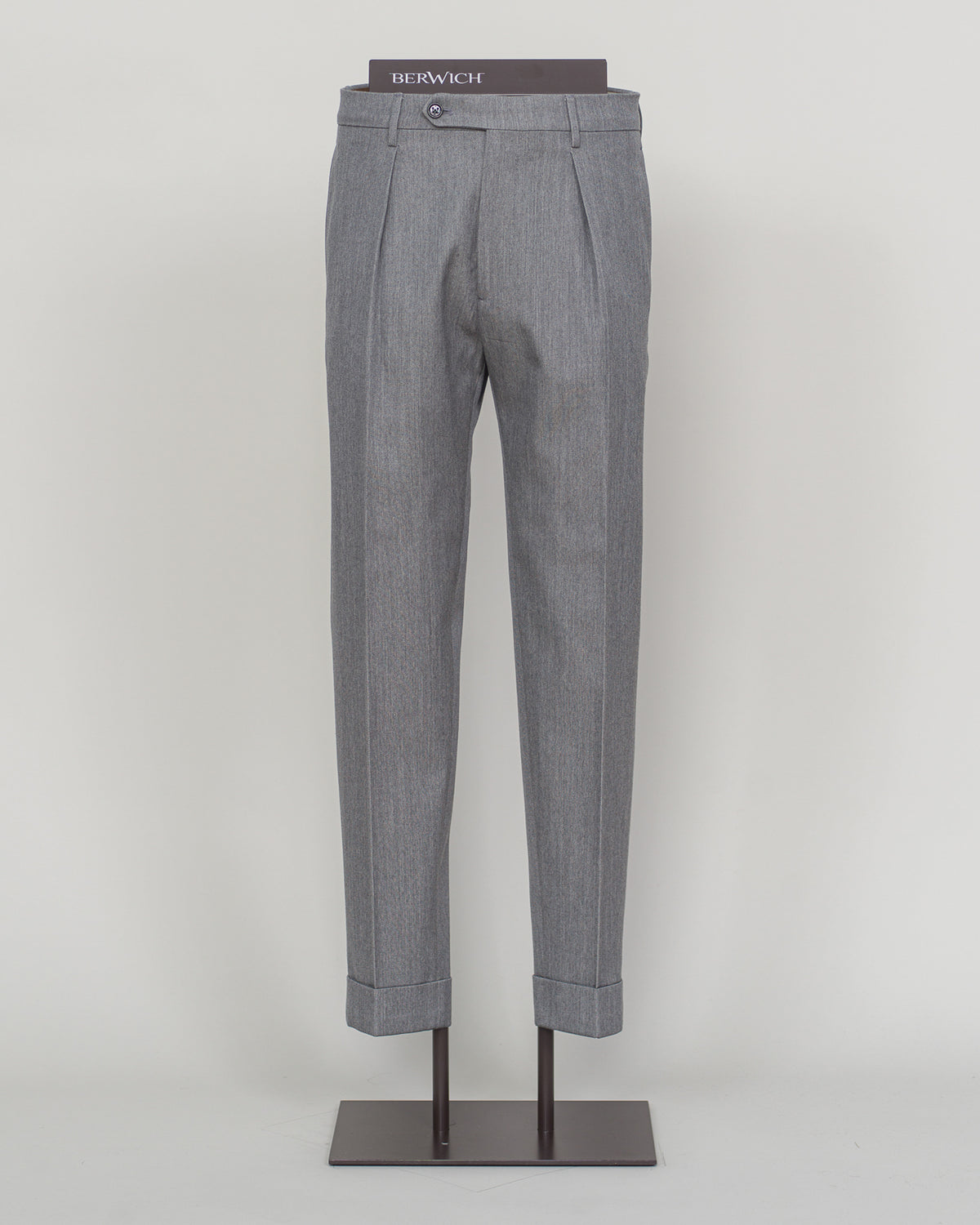 Crafted from a refined blend of wool and cotton, these Berwich trousers exemplify Italian tailoring at its finest. The long-staple gabardine weave delivers a subtle lustre and exceptional drape, while the balanced fibre composition ensures breathability and durability across seasons.
The versatile grey tone pairs seamlessly with sport coats, knitwear, and tailored jackets. Clean lines and a measured cut reflect contemporary menswear proportions without compromise on classic elegance.
A foundation piece fo