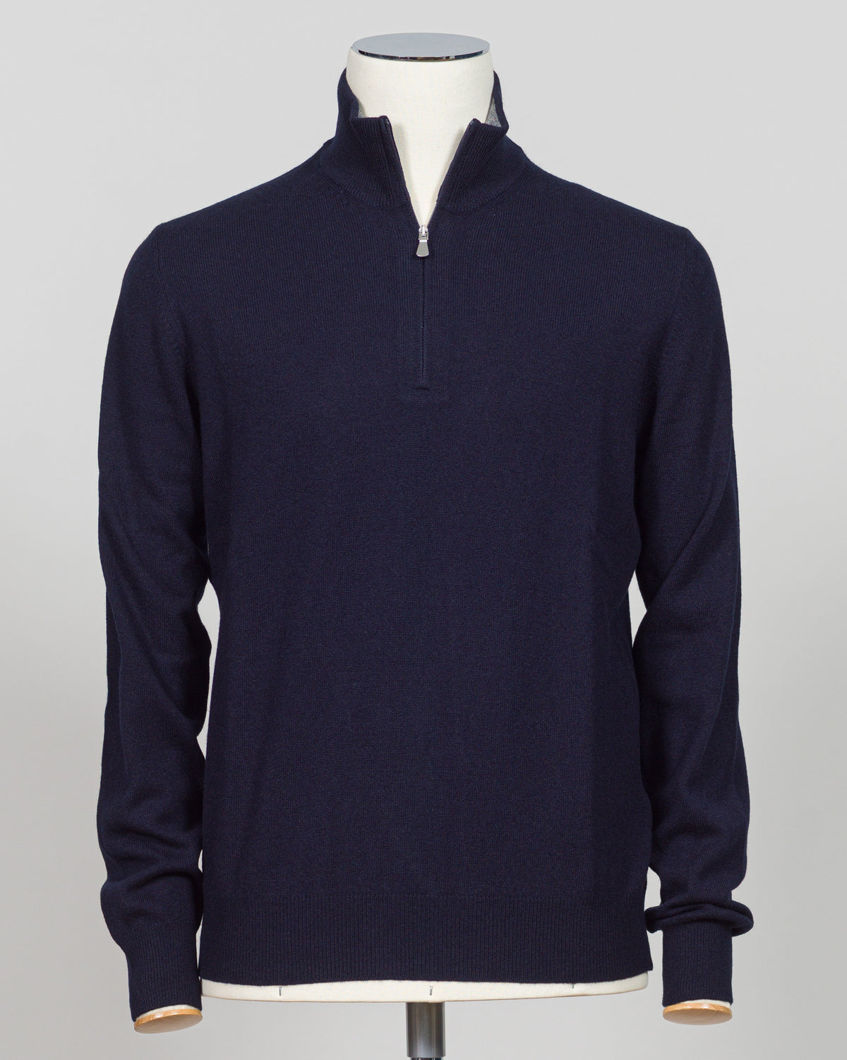 Elevate your everyday layering with this essential half-zip knit from Gran Sasso. Crafted from premium Italian yarn, the navy colorway offers versatility across seasons and occasions. The half-zip silhouette provides adaptable warmth, while the refined construction delivers the understated luxury Gran Sasso is known for. Perfect for layering beneath tailored blazers or wearing standalone with dress trousers. Gran Sasso Half-Zip Knit / Navy
