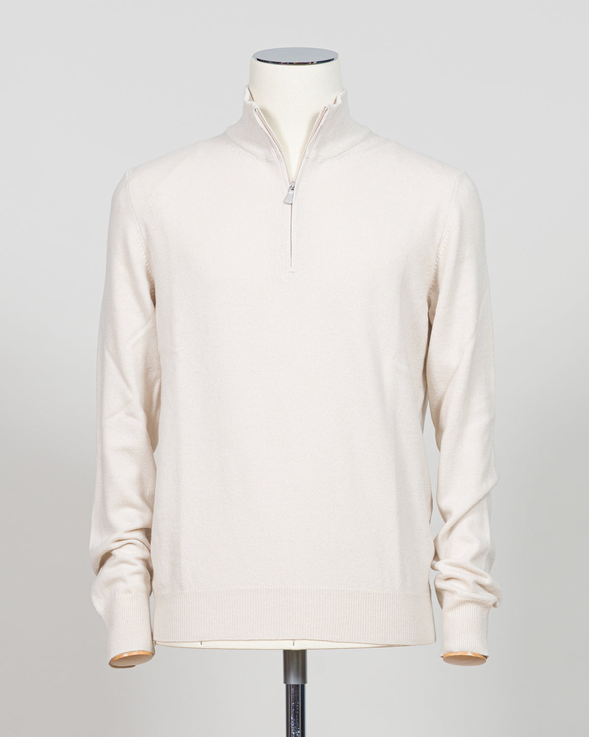 Refined Italian knitwear with timeless appeal. This Gran Sasso half-zip features a supple construction in bone white, designed for layering versatility and everyday sophistication. The relaxed silhouette pairs seamlessly with tailored trousers or casual wear, while premium yarn quality ensures durability and comfort through seasons of wear. A refined essential for the discerning wardrobe.