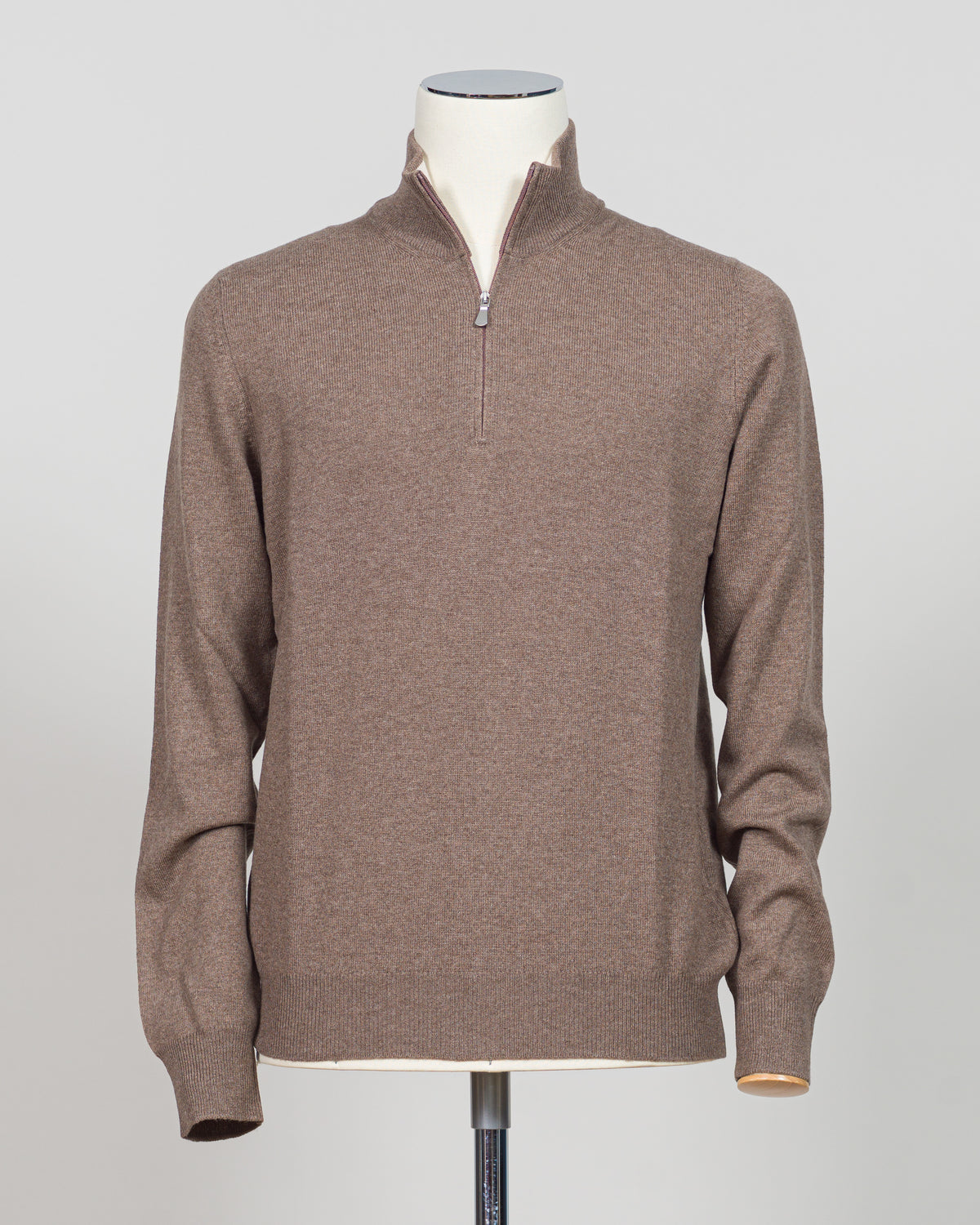 A refined essential in luxurious wool. Gran Sasso's half-zip knit in taupe delivers effortless sophistication with a timeless silhouette that transitions seamlessly across seasons. The soft, breathable construction ensures comfort whether layered under a blazer or worn as a standalone piece. Perfect for those who appreciate understated quality and versatile wardrobe foundations.