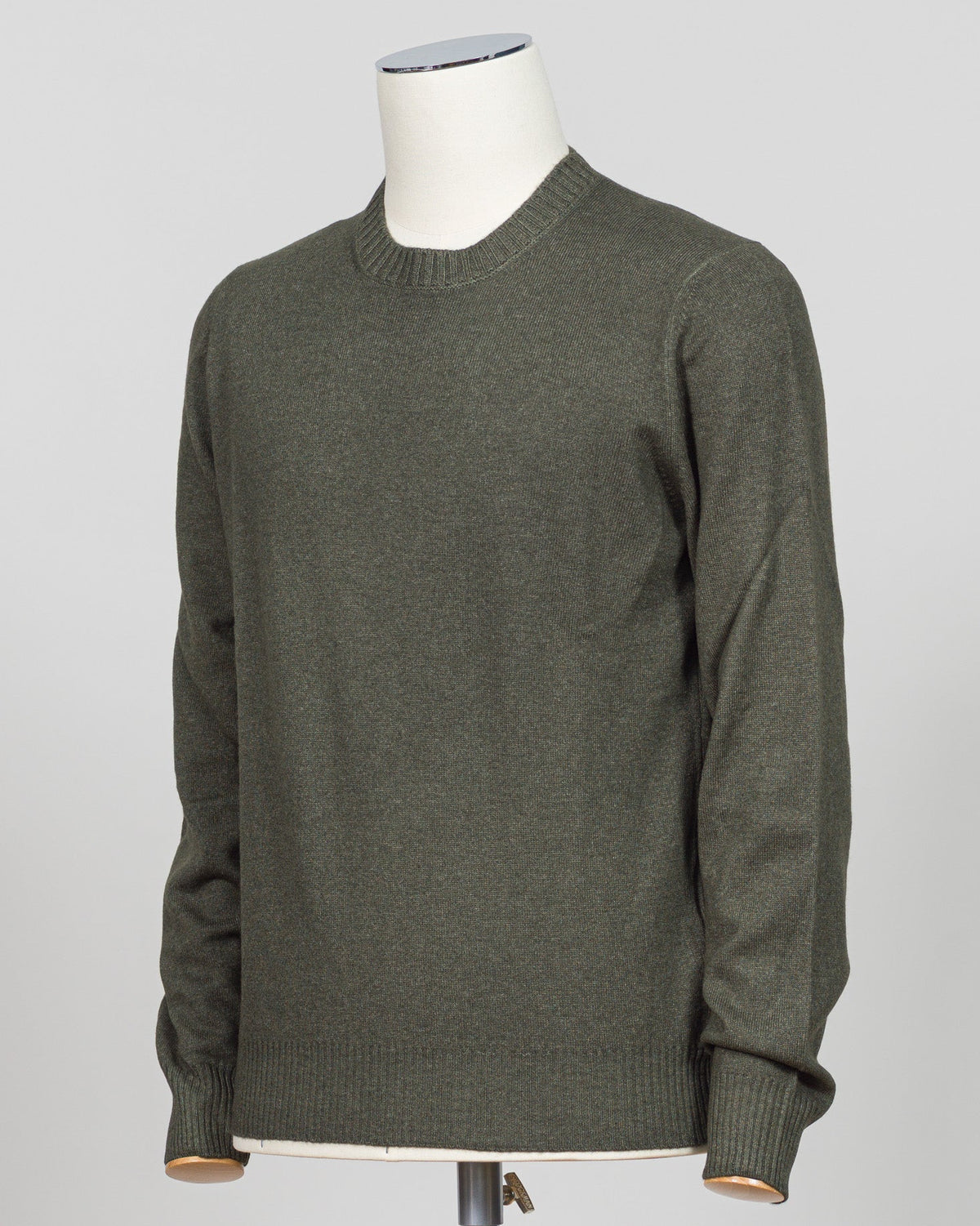 Italian luxury knitwear in a warm vintage dark green. Gran Sasso's refined crewneck delivers timeless sophistication with superior craftsmanship—a versatile layering piece that pairs effortlessly with tailored trousers or casual separates. Premium construction ensures lasting comfort and durability. Gran Sasso Vintage Crewneck / Dark Green