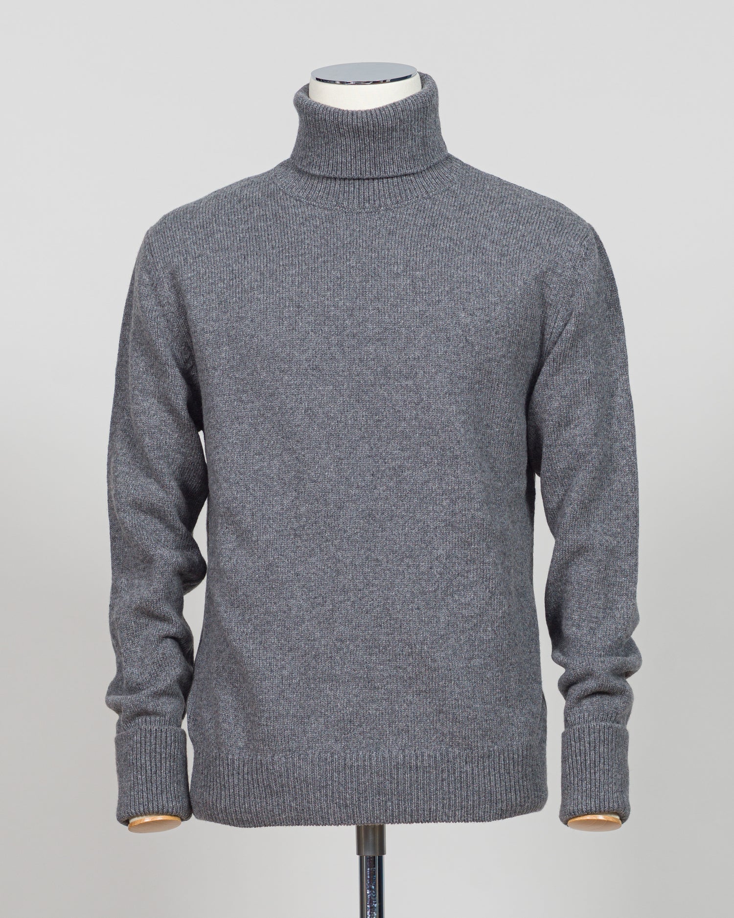 Crafted from premium Italian yarn, the G.R.P. Firenze rollneck knit delivers refined simplicity with architectural precision. The elevated grey tone pairs seamlessly with tailored pieces, while the structured rollneck and clean finish reflect the meticulous construction standards of contemporary menswear. Ideal for layering or worn as a statement piece, this knit bridges casual elegance with wardrobing versatility.