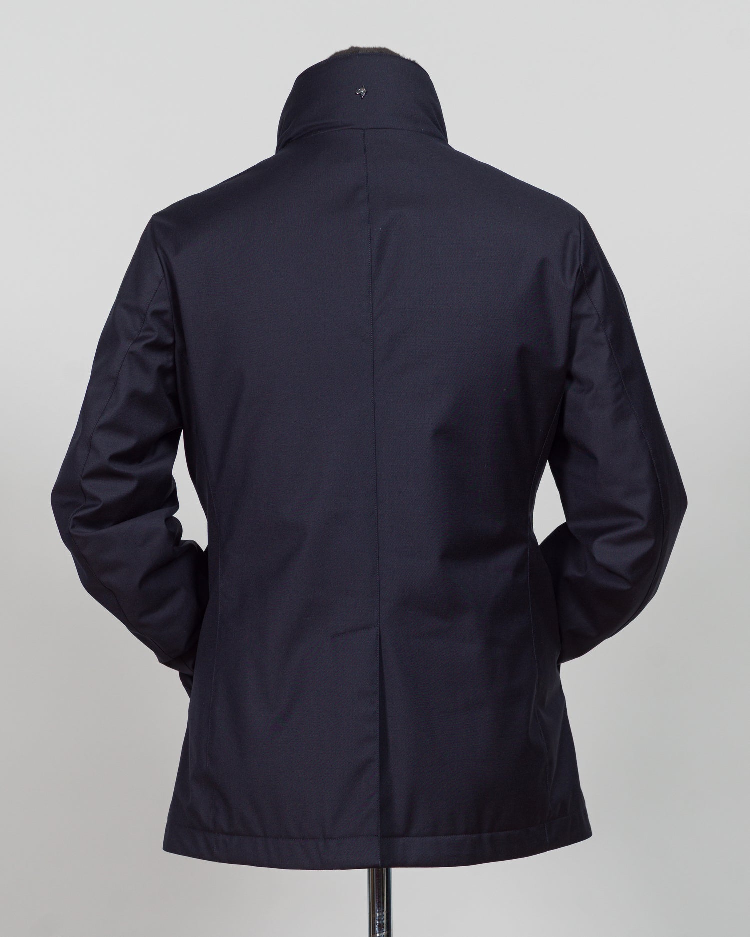 Montecore's double-breasted down jacket combines Italian tailoring precision with practical outerwear design. Navy wool outer with premium down filling delivers warmth without bulk, while structured shoulders and clean lines reflect luxury menswear craftsmanship. Horn buttons and internal quilting detail elevate everyday wear.
Perfect for layering across seasons—wear over knitwear or dress shirts. The relaxed yet refined silhouette suits both smart-casual and dressier occasions. Wind and water-resistant fi