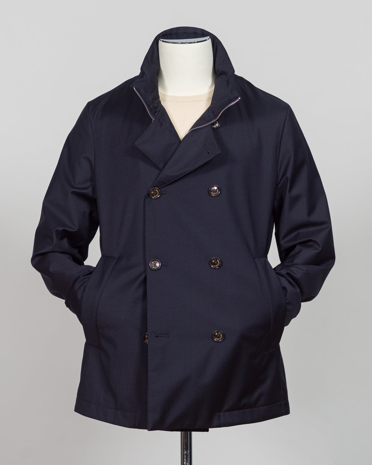 Montecore's double-breasted down jacket combines Italian tailoring precision with practical outerwear design. Navy wool outer with premium down filling delivers warmth without bulk, while structured shoulders and clean lines reflect luxury menswear craftsmanship. Horn buttons and internal quilting detail elevate everyday wear.
Perfect for layering across seasons—wear over knitwear or dress shirts. The relaxed yet refined silhouette suits both smart-casual and dressier occasions. Wind and water-resistant fi