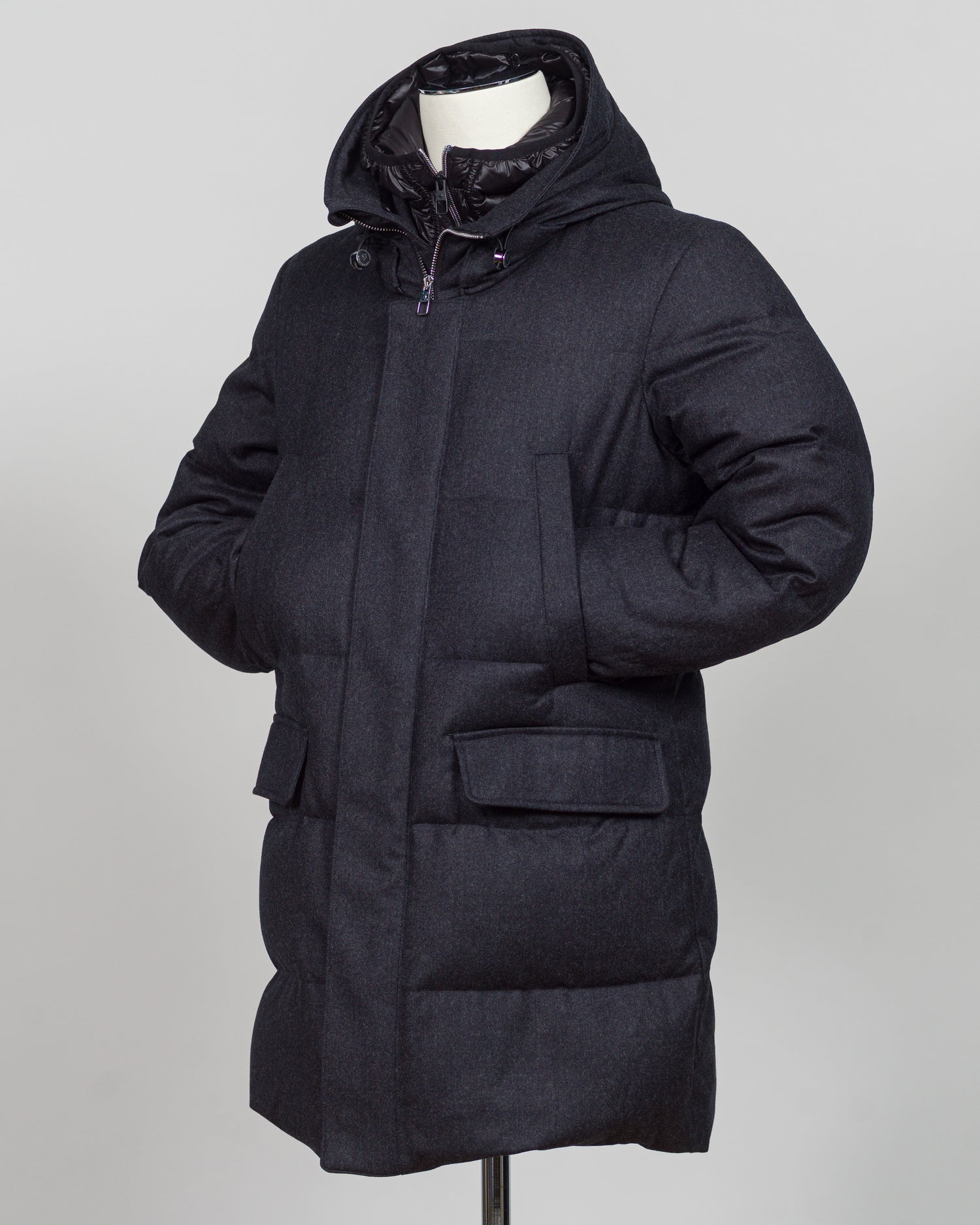 The Montecore VBC Flannel Down Coat delivers refined warmth with understated sophistication. Crafted from premium VBC flannel in deep charcoal grey, this jacket balances structure and comfort for versatile layering across seasons.
Filled with responsibly sourced down insulation, it provides exceptional thermal efficiency without excess bulk. The classic silhouette suits tailored wardrobes—layer it over dress shirts for office wear or pair casually with knitwear for weekend elegance.
VBC's heritage Italian