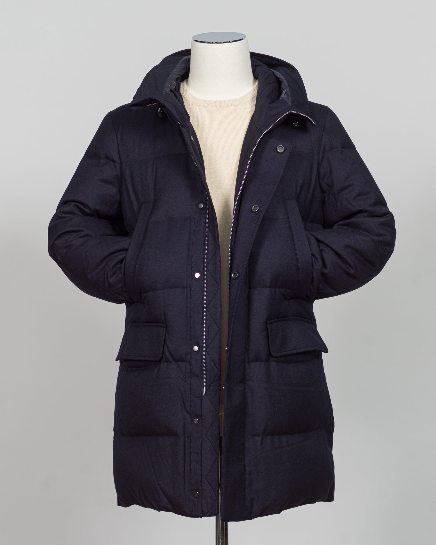 The Montecore VBC Flannel Down Coat delivers refined warmth with understated sophistication. Crafted from premium VBC flannel in navy, this jacket balances structure and comfort for versatile layering across seasons.
Filled with responsibly sourced down insulation, it provides exceptional thermal efficiency without excess bulk. The classic silhouette suits tailored wardrobes—layer it over dress shirts for office wear or pair casually with knitwear for weekend elegance.
VBC's heritage Italian mills ensure