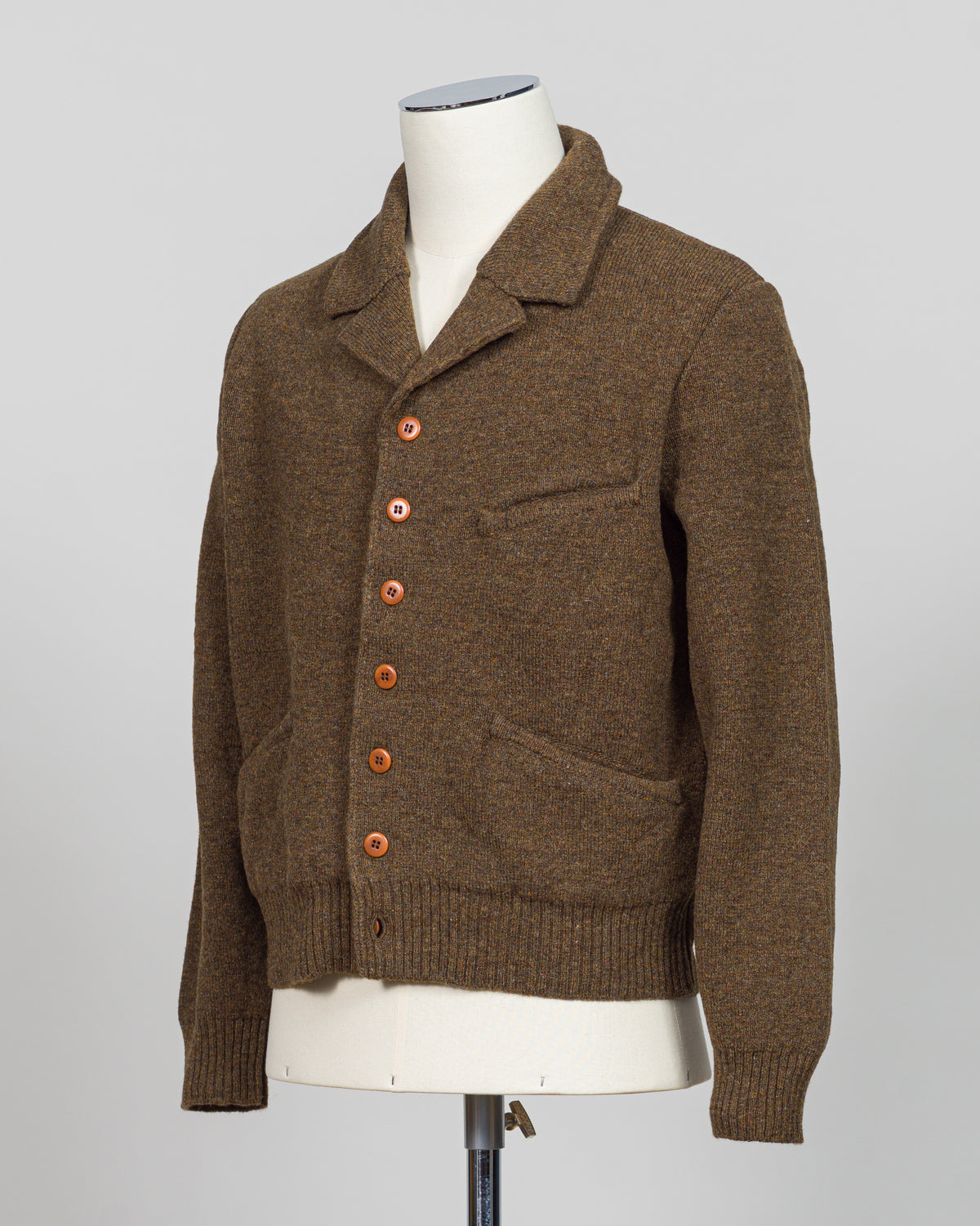 A masterful collaboration between G.R.P. Firenze and Max Rohr, this knitted wool jacket merges Italian craftsmanship with contemporary design. The rich brown tone offers versatile styling across seasons, while the structured knit construction provides both warmth and refined elegance. Perfect for layering or wearing as a statement piece, this jacket embodies the luxury menswear aesthetic with its understated sophistication and impeccable attention to detail.