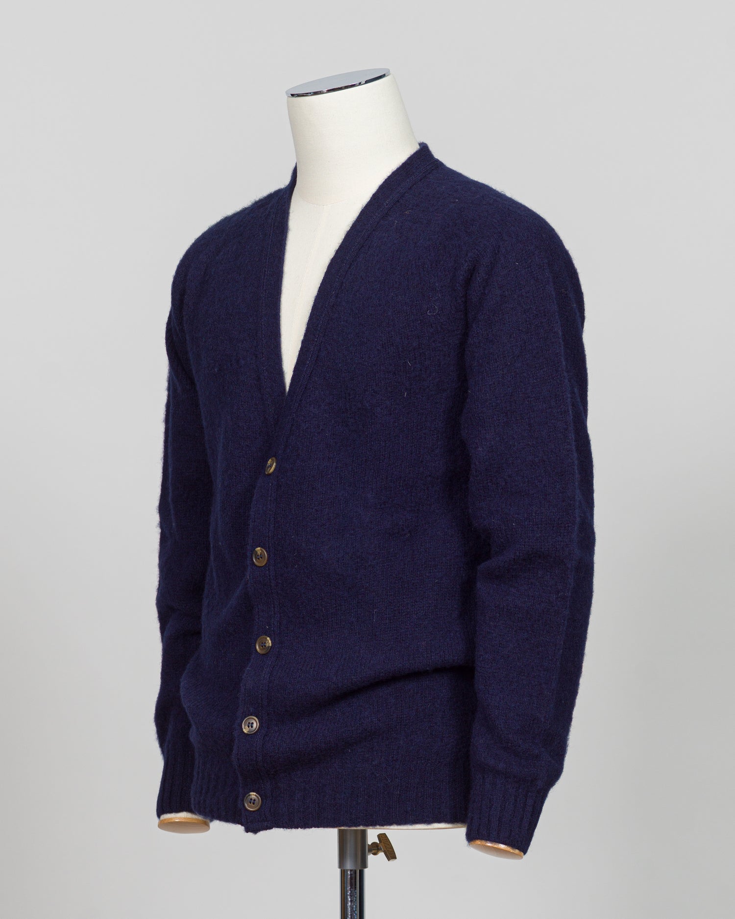 A timeless shaggy cardigan from Harley of Scotland, crafted in luxurious navy wool. This investment piece features a distinctive textured knit that adds depth and character to any wardrobe. Perfect for layering over shirts or wearing as a standalone statement, it delivers the rugged sophistication that defines Scottish knitwear heritage. The relaxed fit and substantial construction ensure years of wear, making it an essential addition to a refined menswear collection.