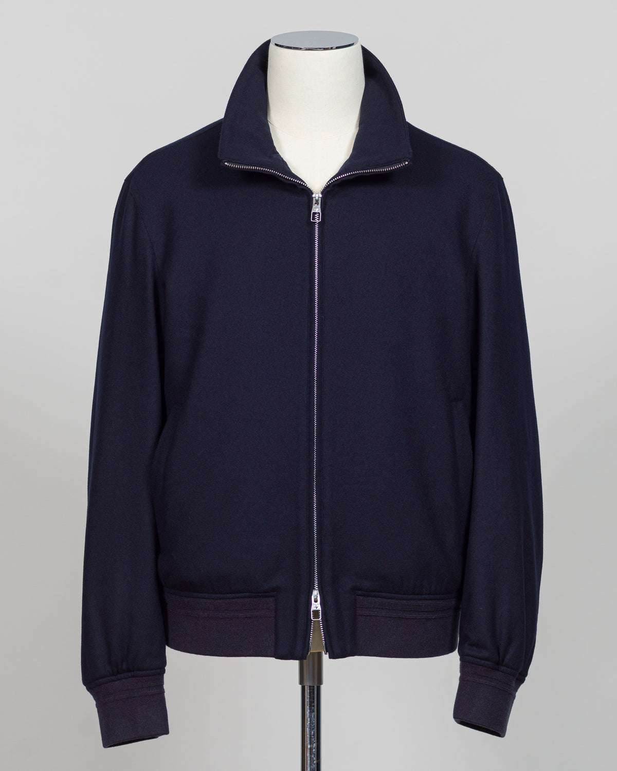 The Montecore Blouson Jacket exemplifies modern tailoring with its refined silhouette and versatile navy colorway. Crafted from premium materials, this blouson delivers structured elegance suitable for both professional and refined casual settings.
The jacket features a contemporary fit that balances comfort with polished aesthetics. Its streamlined design works seamlessly layered over knitwear or worn as a standalone piece, making it an essential addition to a curated wardrobe.
Ideal for the discerning g