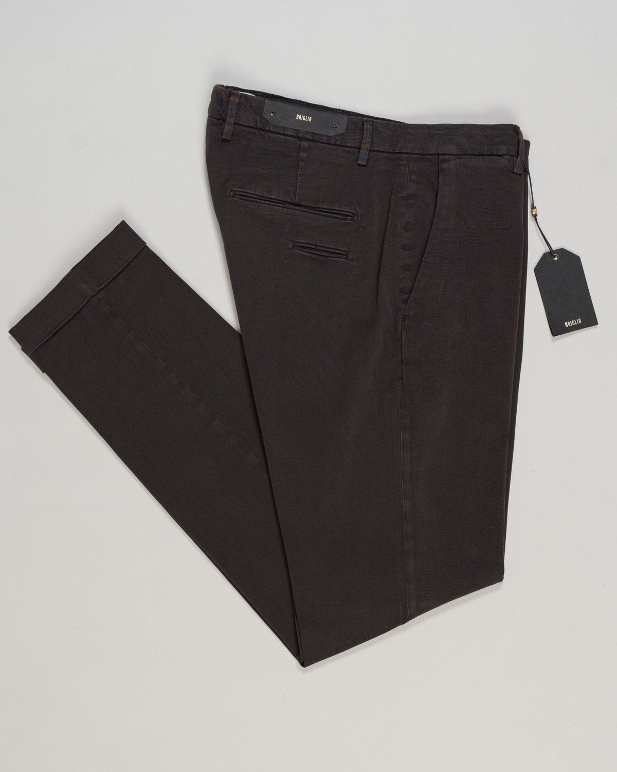 Briglia's garment-dyed cotton chinos deliver understated Italian craftsmanship in a versatile dark brown that pairs effortlessly with any wardrobe. The soft, pre-washed cotton develops character with wear, offering a relaxed yet refined silhouette perfect for both casual weekends and smart-casual occasions. Premium construction and attention to detail make these a timeless staple for the discerning gentleman. Briglia Garment Dyed Cotton Chinos / Dark Brown