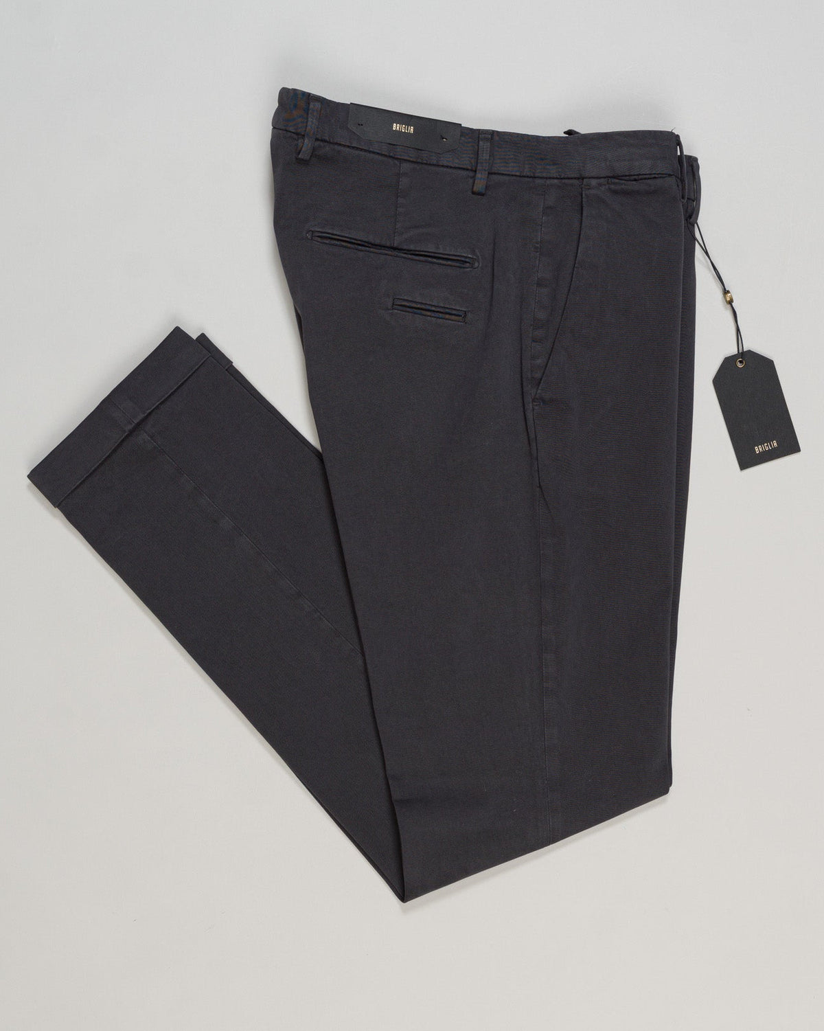 Briglia's garment-dyed cotton chinos deliver understated Italian craftsmanship in a versatile dark grey that pairs effortlessly with any wardrobe. The soft, pre-washed cotton develops character with wear, offering a relaxed yet refined silhouette perfect for both casual weekends and smart-casual occasions. Premium construction and attention to detail make these a timeless staple for the discerning gentleman. Briglia Garment Dyed Cotton Chinos / Dark Grey