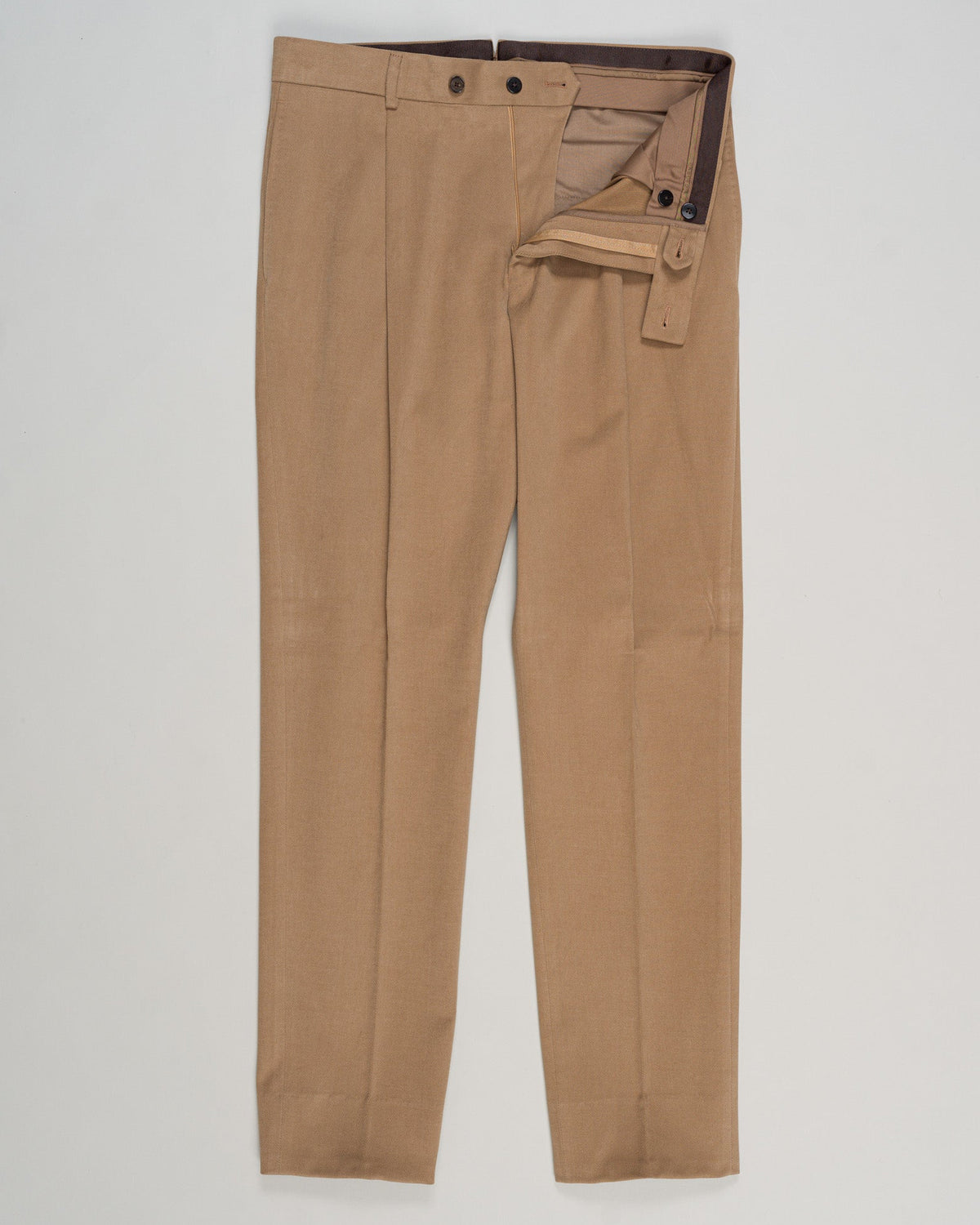 Refined cotton tailoring in a warm neutral tone. These brushed cotton trousers from Caruso deliver understated elegance through premium fabrication and precise construction. The biscotto shade complements both classic knitwear and formal shirting, making them a versatile foundation for refined wardrobes. Ideal for those seeking quality basics with measurable comfort and longevity. Caruso Brushed Cotton Trousers / Biscotto