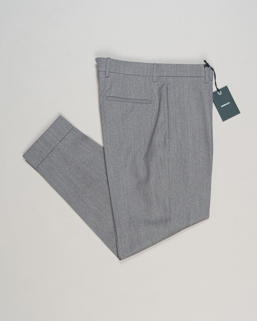 Crafted from a refined blend of wool and cotton, these Berwich trousers exemplify Italian tailoring at its finest. The long-staple gabardine weave delivers a subtle lustre and exceptional drape, while the balanced fibre composition ensures breathability and durability across seasons.
The versatile grey tone pairs seamlessly with sport coats, knitwear, and tailored jackets. Clean lines and a measured cut reflect contemporary menswear proportions without compromise on classic elegance.
A foundation piece fo