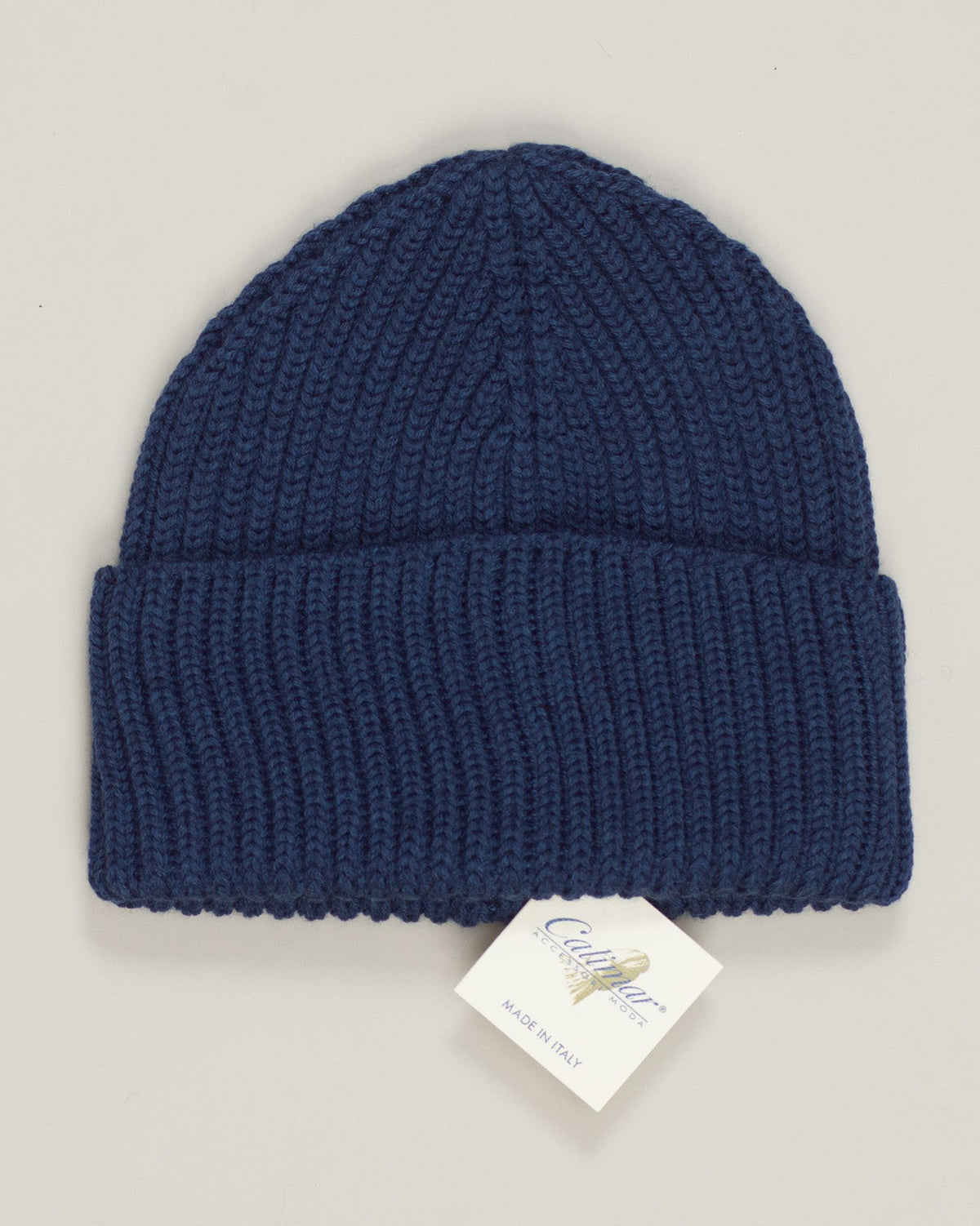 Crafted from premium ribbed merino wool, this cobalt blue beanie delivers refined warmth without compromise. The tight knit construction offers excellent shape retention and breathability, ideal for cooler seasons. A timeless essential that pairs seamlessly with any wardrobe. Merino's natural temperature regulation keeps you comfortable whether you're outdoors or transitioning indoors. Calimar Ribbed Merino Beanie / Cobalt Blue