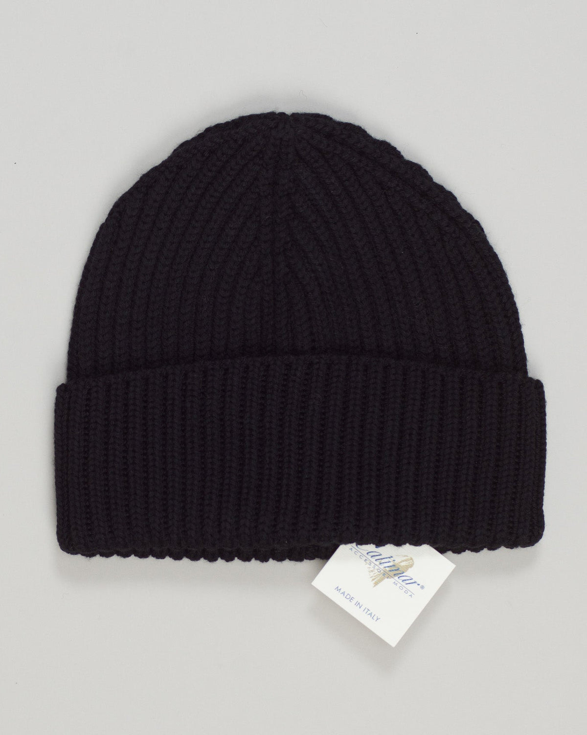 Crafted from pure merino wool, this ribbed beanie delivers warmth and breathability in equal measure. The fine-gauge knit resists pilling while maintaining its shape through countless wears. A timeless essential that transitions seamlessly from casual to refined settings, offering quiet sophistication in a versatile black tone.Calimar Ribbed Merino Beanie / Black