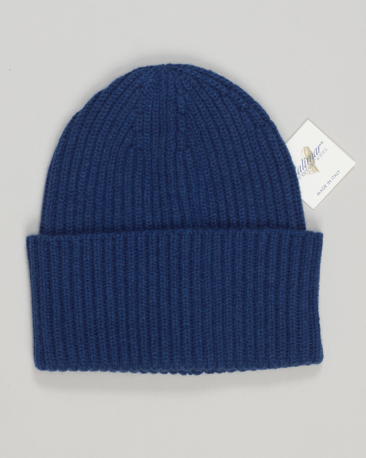 Pure cashmere beanie in a refined indigo hue. Soft, breathable knit that moves with you through seasons. Simple, timeless design that pairs effortlessly with any wardrobe. Lightweight enough for layering or worn alone on cooler days. A luxury essential that transcends trends. Calimar Cashmere Beanie / Indigo