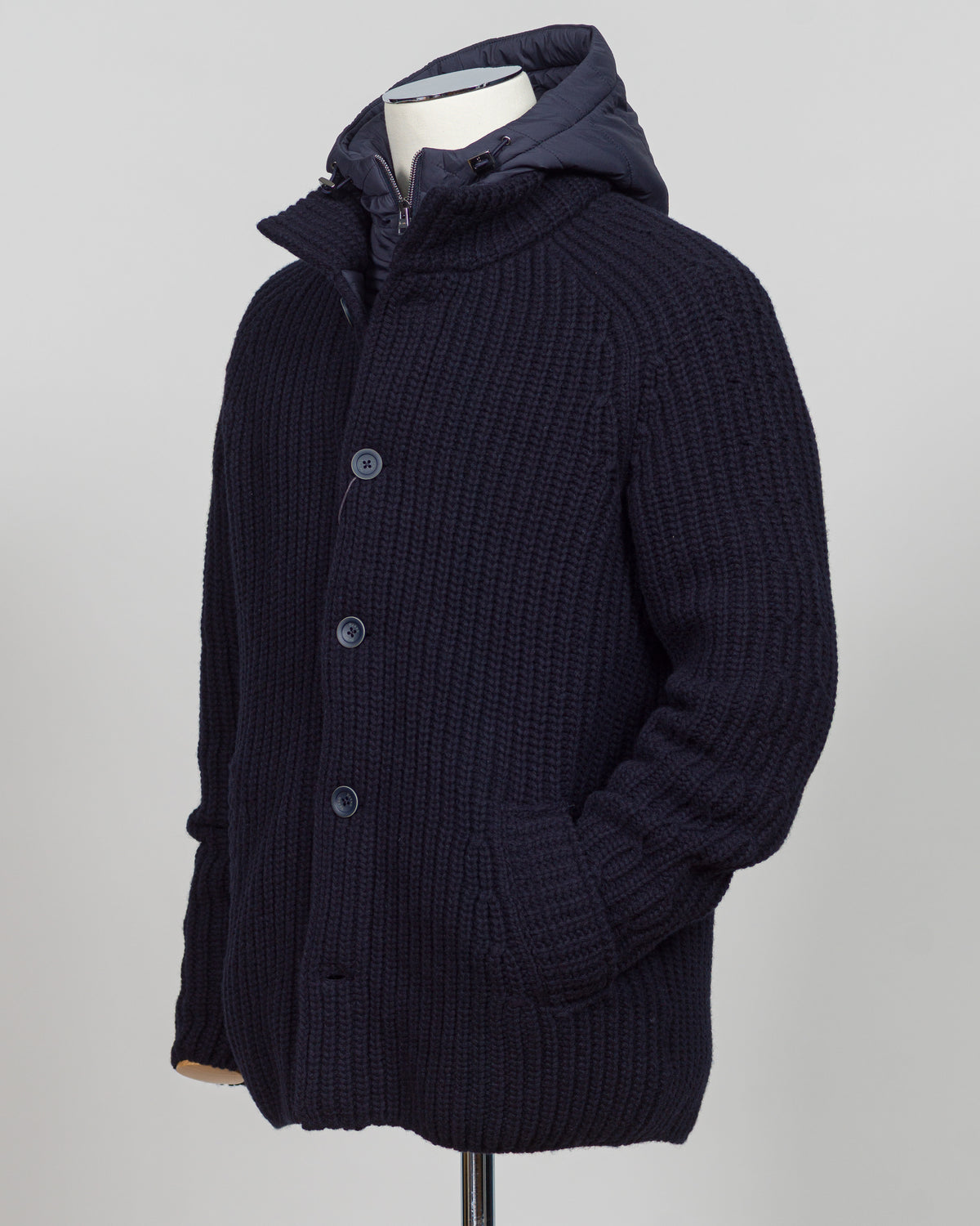 Herno's lined cardigan in navy combines Italian craftsmanship with refined minimalism. Constructed from premium wool with a structured silhouette, the interior lining ensures comfort through layering or as a standalone piece. The clean lines and versatile navy tone work seamlessly with tailored trousers or casual wear, making it an essential addition to a modern menswear wardrobe. Perfect for transitional seasons or layering year-round.