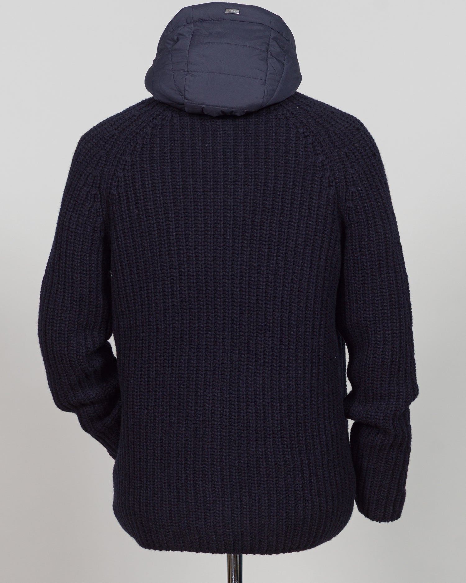 Herno's lined cardigan in navy combines Italian craftsmanship with refined minimalism. Constructed from premium wool with a structured silhouette, the interior lining ensures comfort through layering or as a standalone piece. The clean lines and versatile navy tone work seamlessly with tailored trousers or casual wear, making it an essential addition to a modern menswear wardrobe. Perfect for transitional seasons or layering year-round.