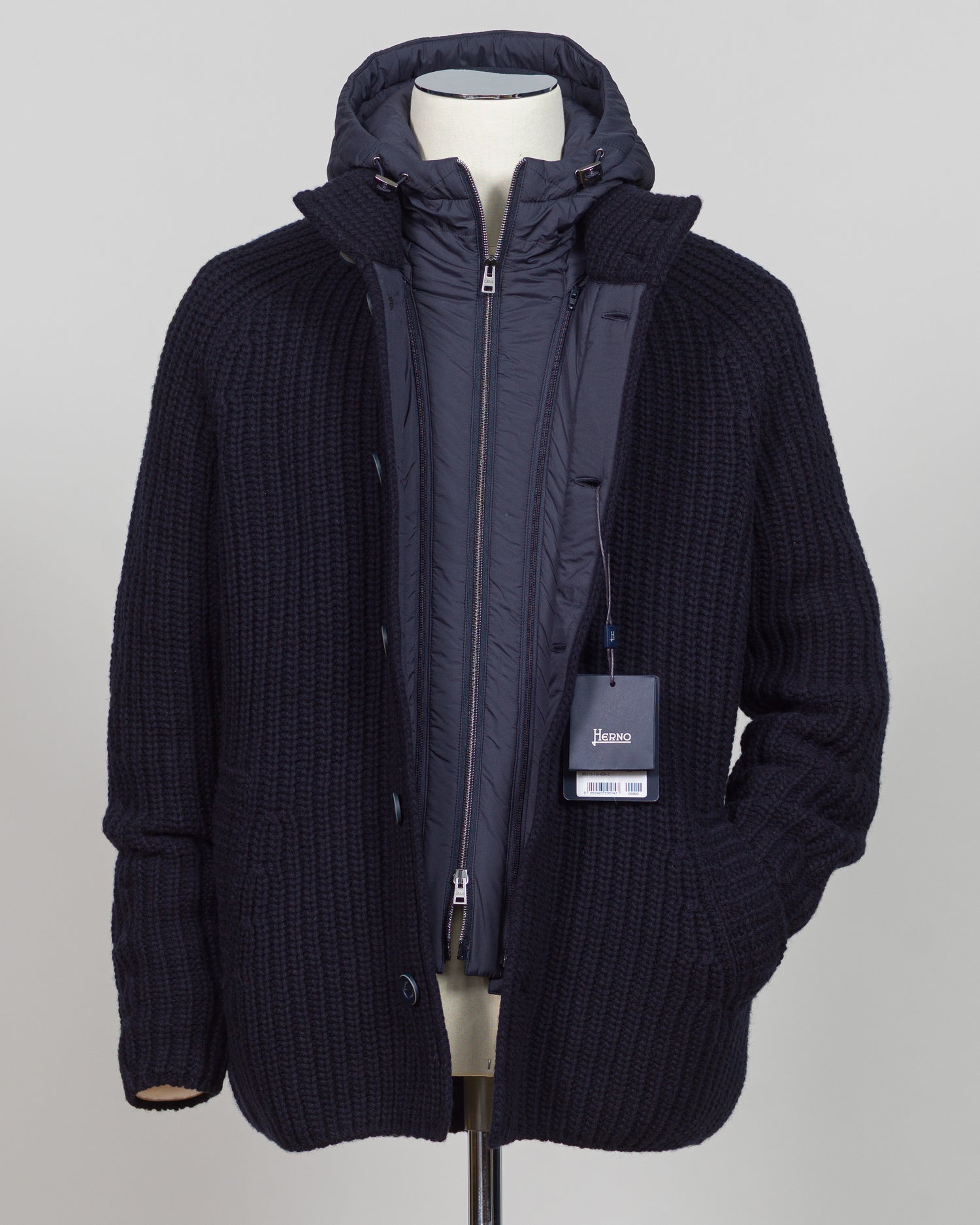 Herno's lined cardigan in navy combines Italian craftsmanship with refined minimalism. Constructed from premium wool with a structured silhouette, the interior lining ensures comfort through layering or as a standalone piece. The clean lines and versatile navy tone work seamlessly with tailored trousers or casual wear, making it an essential addition to a modern menswear wardrobe. Perfect for transitional seasons or layering year-round.