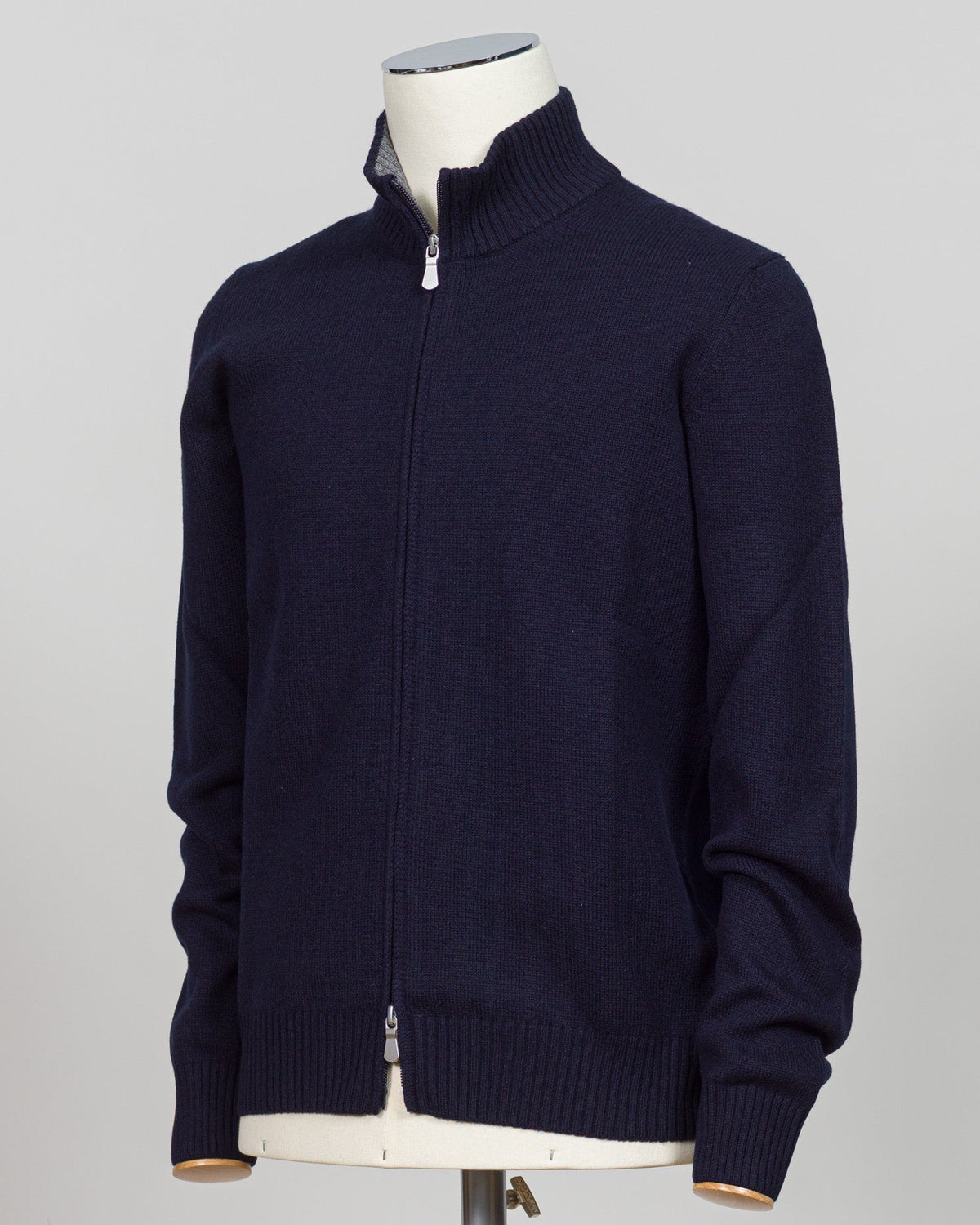 Gran Sasso's full-zip knit is a versatile layering essential crafted from premium Italian yarn. The clean navy colorway pairs effortlessly with tailored trousers or casual wear, while the structured construction ensures a refined silhouette season after season. Designed for those who appreciate quality knitwear without compromise. Gran Sasso Full-Zip Knit / Navy