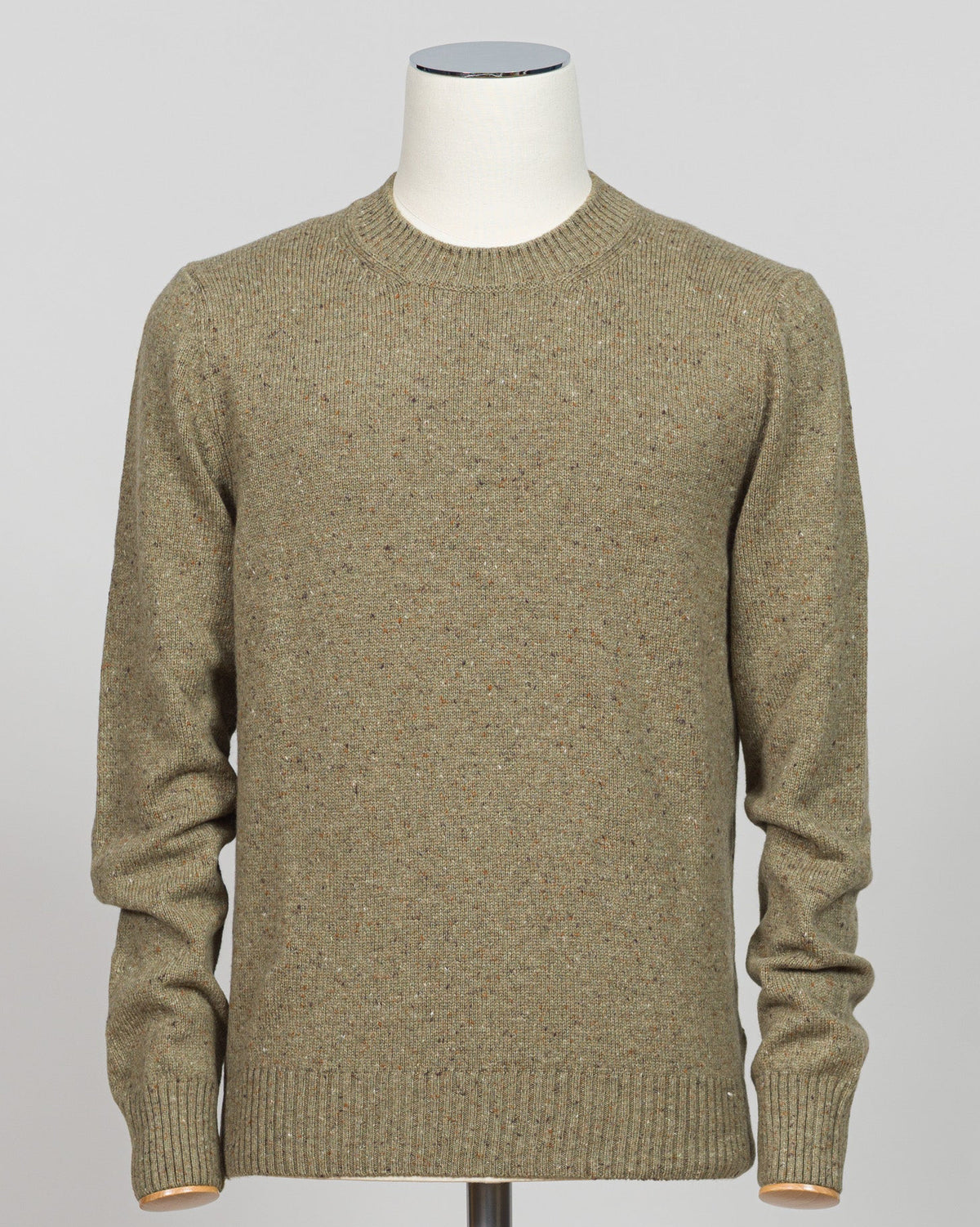 Italian craftsmanship meets understated elegance in this Gran Sasso crew neck, woven from luxurious Donegal yarn. The subtle texture of the characteristic nub creates visual depth while maintaining a refined silhouette. Cut in a versatile green that complements both casual and smart-casual wardrobes, this knit layers effortlessly beneath blazers or stands alone as a statement piece. Perfect for those who appreciate quality construction and timeless design. Gran Sasso Donegal Crew Neck / Green