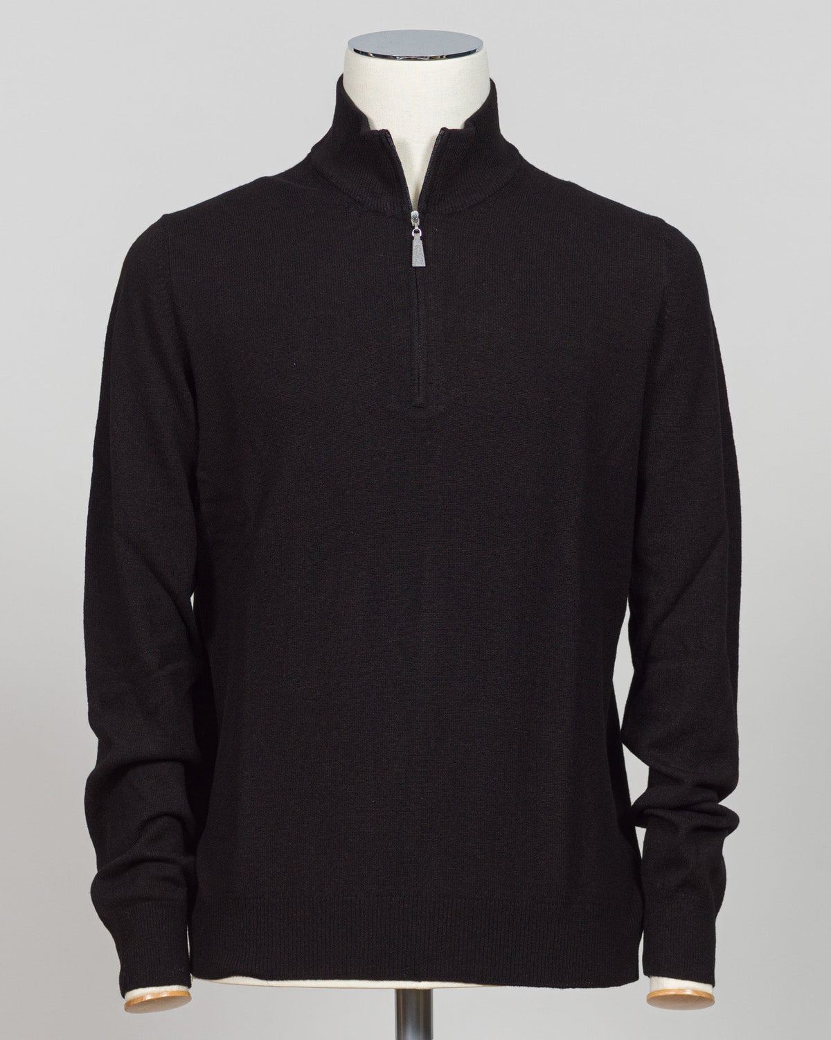 A refined half-zip in Gran Sasso's signature blend of wool and cashmere. The substantial knit drapes with understated elegance in classic black, offering versatility across layered dressing and standalone wear. Designed for the discerning wardrobe that values both comfort and craftsmanship. Gran Sasso Wool & Cashmere Half-Zip / Black