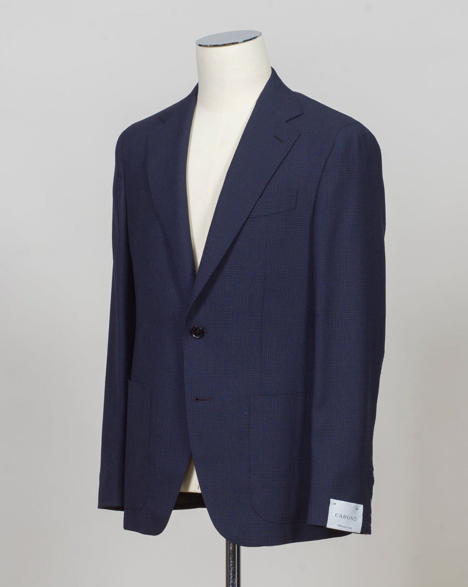 Caruso blazer impeccably tailored in Soragna, Parma, Italy.
Stunning lightness and ease of movement without losing the classic tailored elegance. These are some of the ingredients that make Italian tailoring world famous and you can find it all in Caruso garments.
Beautiful handmade detailing and naturally with a full canvas structure inside.
Model: Aida
Article: 506113
Composition: 100% Wool
Color: 0120 / Navy
2 Patch Pockets
Side vents
Fully Lined
Made in Soragna, Italy
Caruso Glen