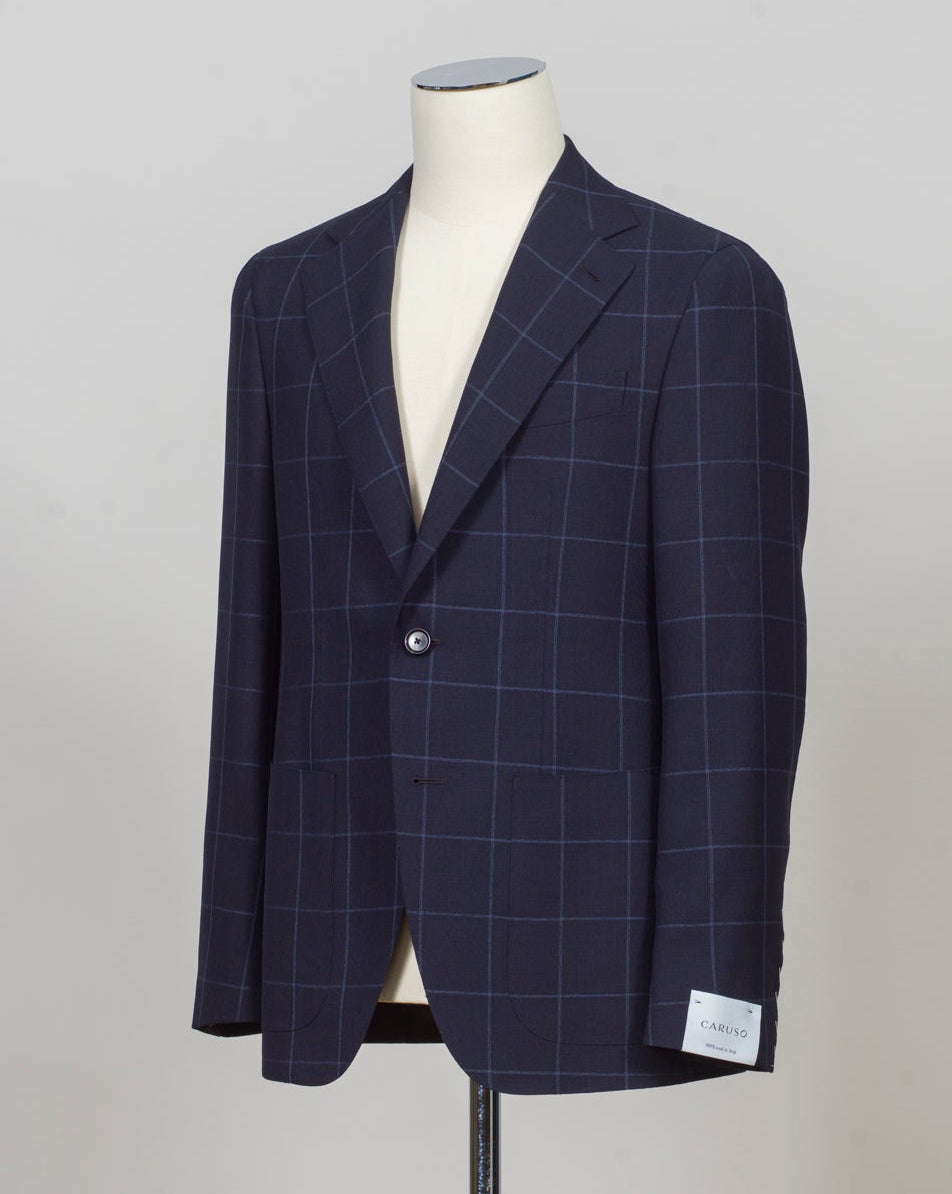 Caruso blazer impeccably tailored in Soragna, Parma, Italy.
Stunning lightness and ease of movement without losing the classic tailored elegance. These are some of the ingredients that make Italian tailoring world famous and you can find it all in Caruso garments.
Beautiful handmade detailing and naturally with a full canvas structure inside.
Model: Aida
Article: 506432
Composition: 100% Wool
Color: 0120 / Navy
2 Patch Pockets
Side vents
Fully Lined
Made in Soragna, Italy Caruso Wind