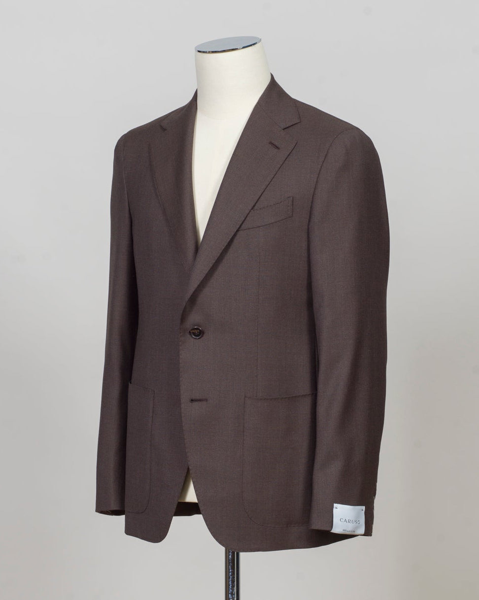 Caruso blazer impeccably tailored in Soragna, Parma, Italy.
Stunning lightness and ease of movement without losing the classic tailored elegance. These are some of the ingredients that make Italian tailoring world famous and you can find it all in Caruso garments.
Beautiful handmade detailing and naturally with a full canvas structure inside.
Model: Aida
Article: PE0826
Composition: 94% Wool 6% Cashmere
Color: 0322 / Brown
2 Patch Pockets
Side vents
Fully Lined Caruso Panama Jacket / Dark Brown