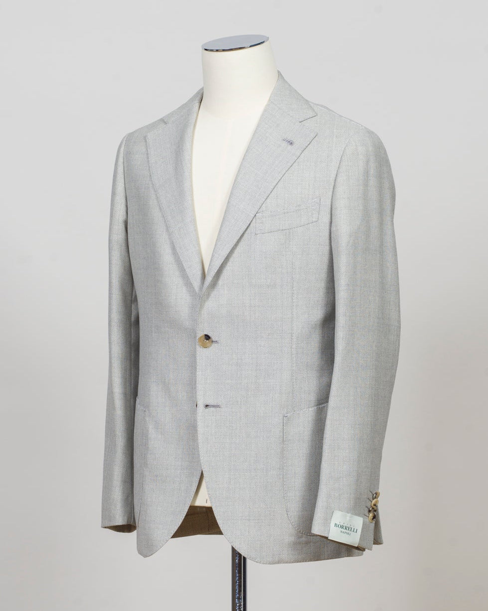 Single breasted
Notch lapel
Two buttons in front
Four sleeve buttons
Welted chest pocket
Patch side pockets
Modello: Sorrento
Hand finished
Half canvas
Half lined
Composition: 100% Virgin Wool
Article: G271012
Col. Light Grey
Made in Napoli, Italy Luigi Borrelli Hopsack Jacket / Light Grey