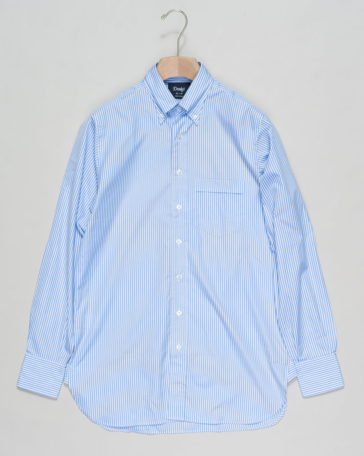 With a regular silhouette, floating interlinings, single-needle construction, and a distinguished button-down collar, it's a shirt for all occasions. Drake's Narrow Stripe Button-Down Poplin Shirt / Sky Blue