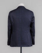 Caruso blazer impeccably tailored in Soragna, Parma, Italy.
Stunning lightness and ease of movement without losing the classic tailored elegance. These are some of the ingredients that make Italian tailoring world famous and you can find it all in Caruso garments. 
Beautiful handmade detailing and naturally with a full canvas structure inside.
Full canvas
Fully lined 
Unconstructed shoulder
Model: Aida
Composition: 54% Wool, 43% Linen, 3% Cashmere
Color: 0120 / Navy Caruso Wool Blend J