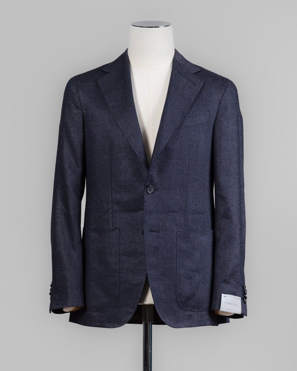 Caruso blazer impeccably tailored in Soragna, Parma, Italy.
Stunning lightness and ease of movement without losing the classic tailored elegance. These are some of the ingredients that make Italian tailoring world famous and you can find it all in Caruso garments.
Beautiful handmade detailing and naturally with a full canvas structure inside.
Full canvas
Fully lined
Unconstructed shoulder
Model: Aida
Composition: 54% Wool, 43% Linen, 3% Cashmere
Color: 0120 / Navy Caruso Wool Blend J