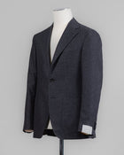 Caruso blazer impeccably tailored in Soragna, Parma, Italy.
Stunning lightness and ease of movement without losing the classic tailored elegance. These are some of the ingredients that make Italian tailoring world famous and you can find it all in Caruso garments. 
Beautiful handmade detailing and naturally with a full canvas structure inside.
Full canvas
Fully lined 
Unconstructed shoulder
Model: Aida
Composition: 95% Wool, 5% Cashmere
Color: 2443 / Black & Grey Caruso Wool &