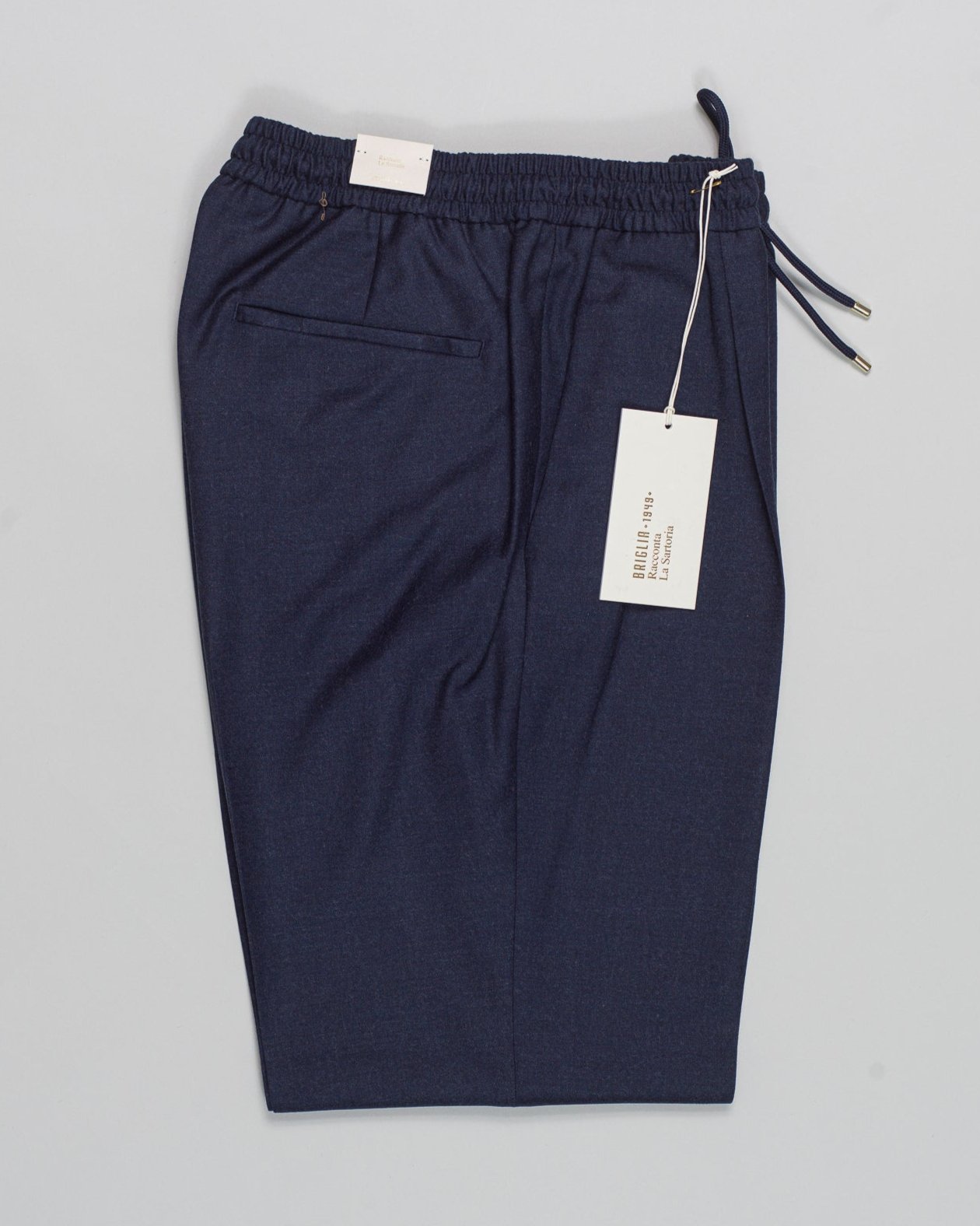 Article: 424120
Model: Wimbledons
Color: Blue / 91
Composition: 99% Virgin Wool 1% Elastan
One Pleat
Slanted side pockets
Drawstring waist
Made in Naples, Italy Briglia Drawstring Flannel Trousers / Blue