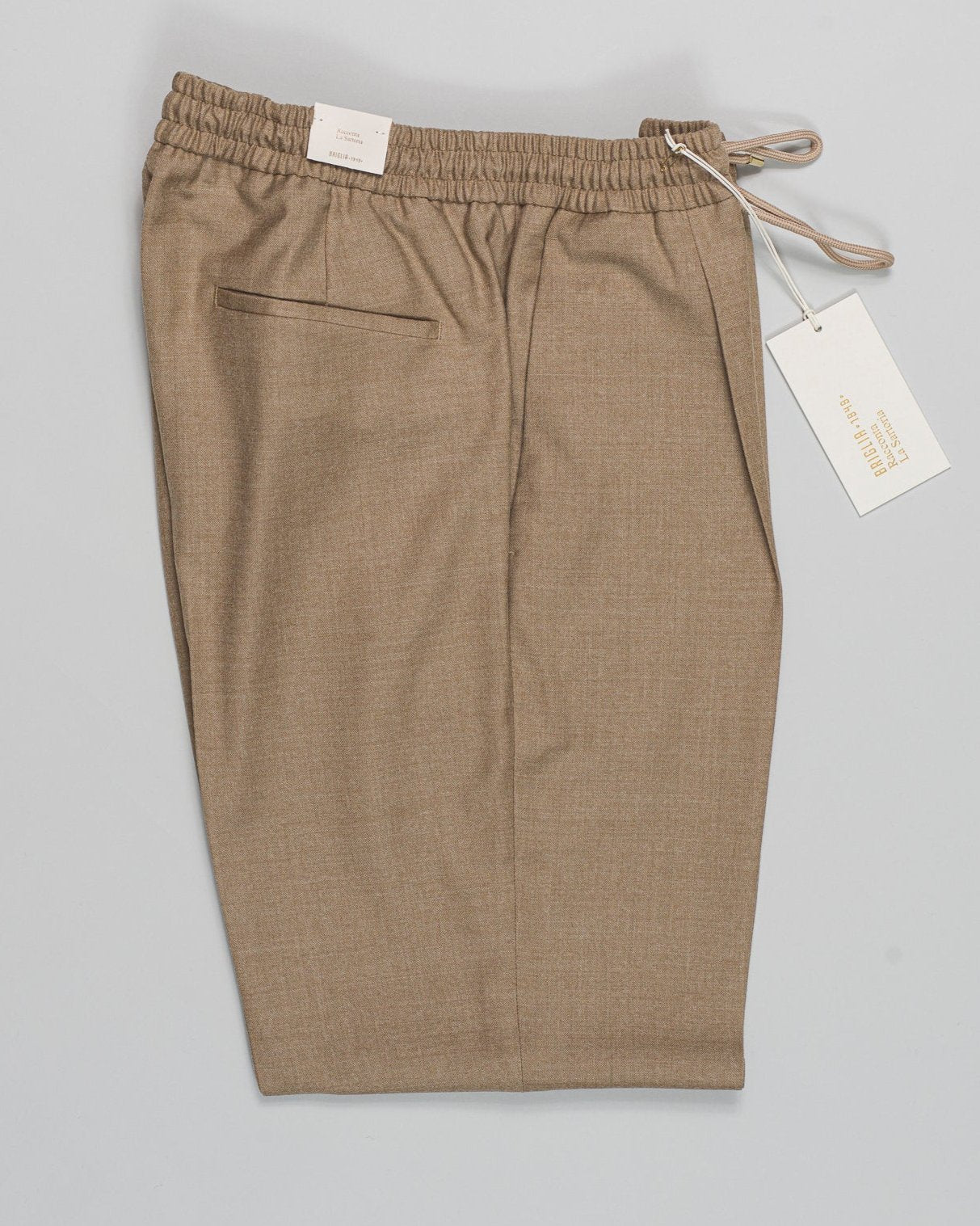 Article: 424120
Model: Wimbledons
Color: Beige / 33
Composition: 99% Virgin Wool 1% Elastan
One Pleat
Slanted side pockets
Drawstring waist
Made in Naples, Italy Briglia Drawstring Flannel Trousers / Beige